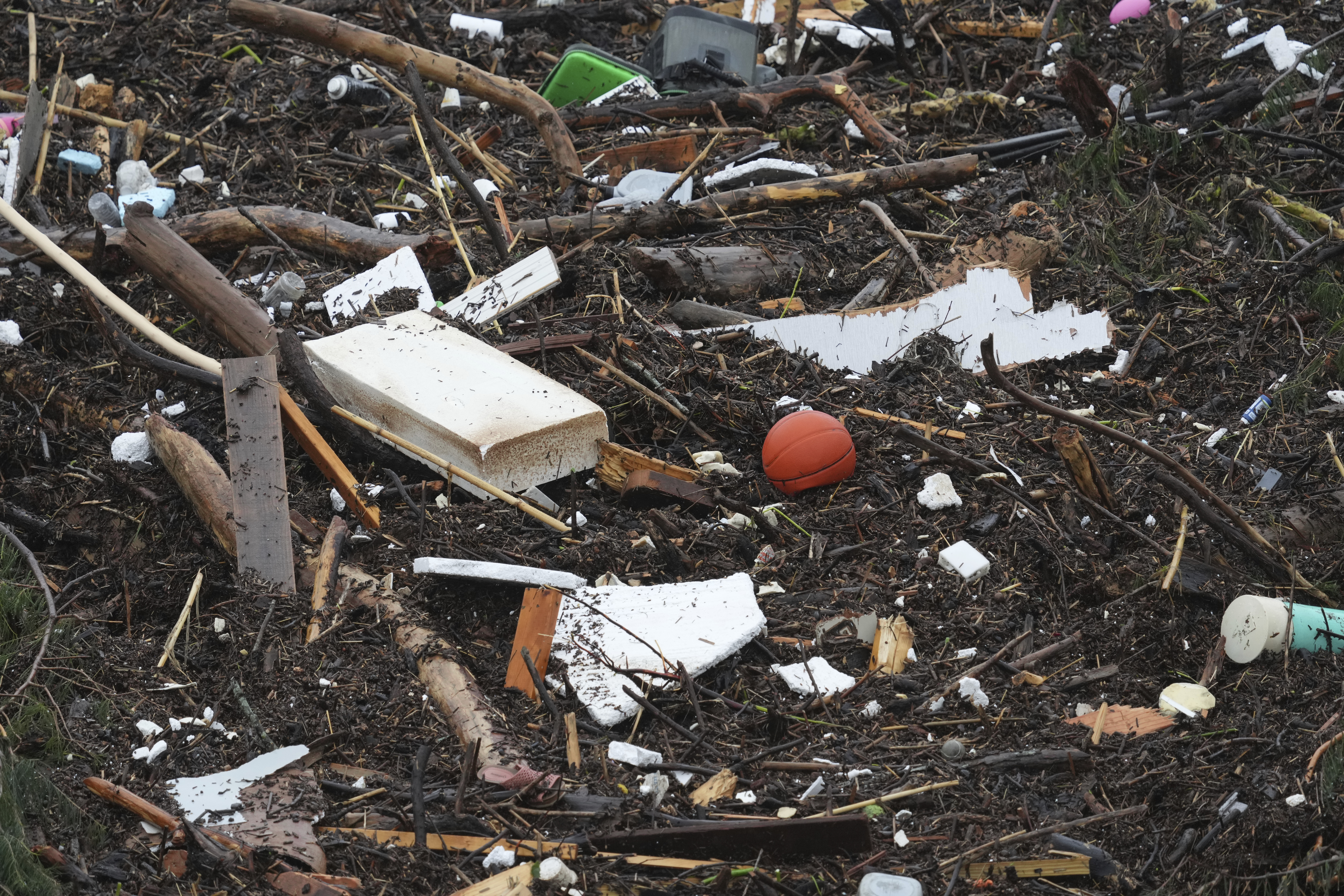 Debris is left behind by a raging Guadalupe River, Friday, July 4, 2025, in Kerrville, Texas. (AP Photo/Eric Gay)