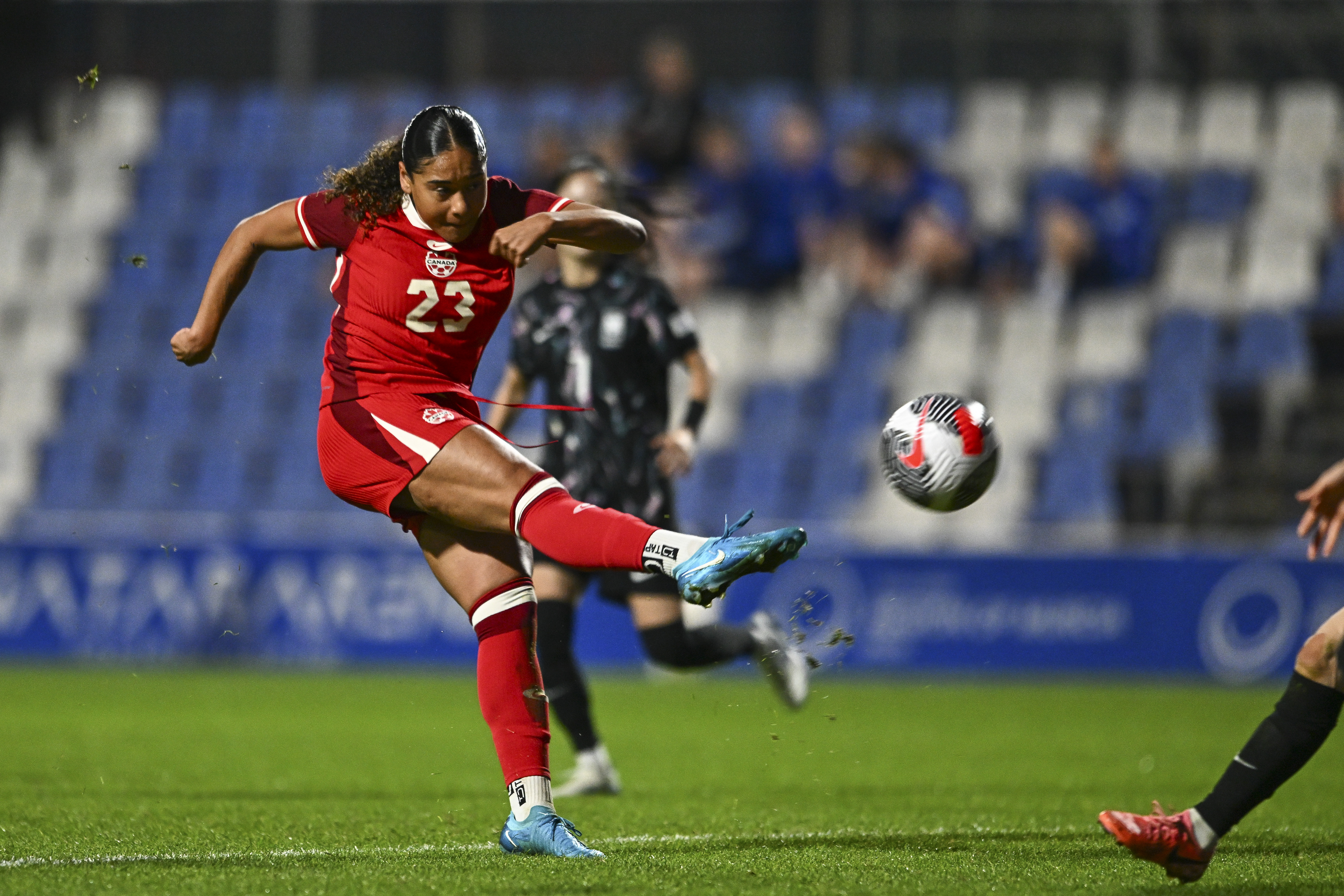 Canada's Olivia Smith tries a football shot.