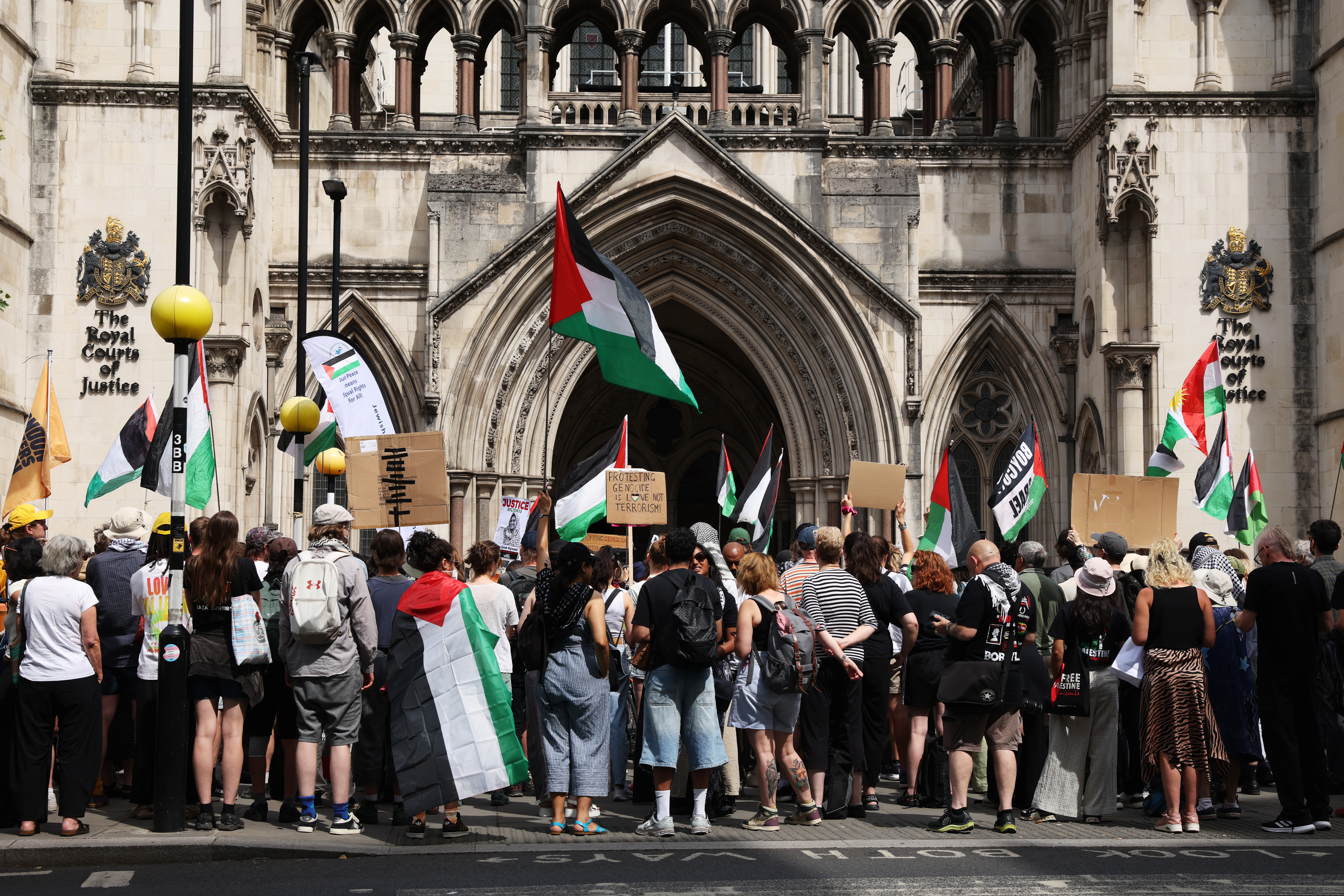 Protester demonstrates outside the High Court as Palestine Action challenges proscription on July 4, 2025 in London, England