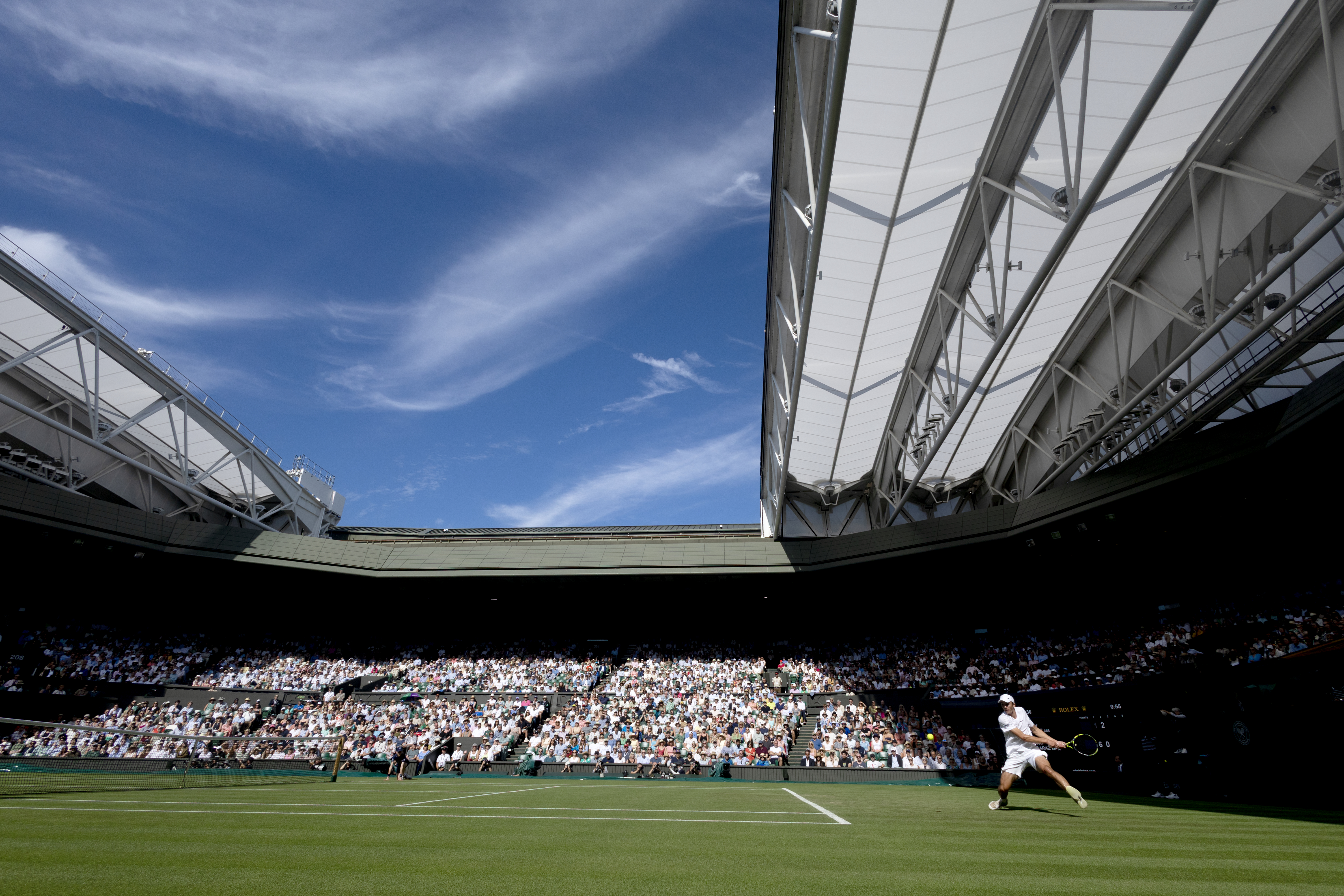 A general view of Oliver Tarvet of Great Britain in action against Carlos Alcaraz of Spain in the second round of the Gentlemen's Singles Competition on Centre Court