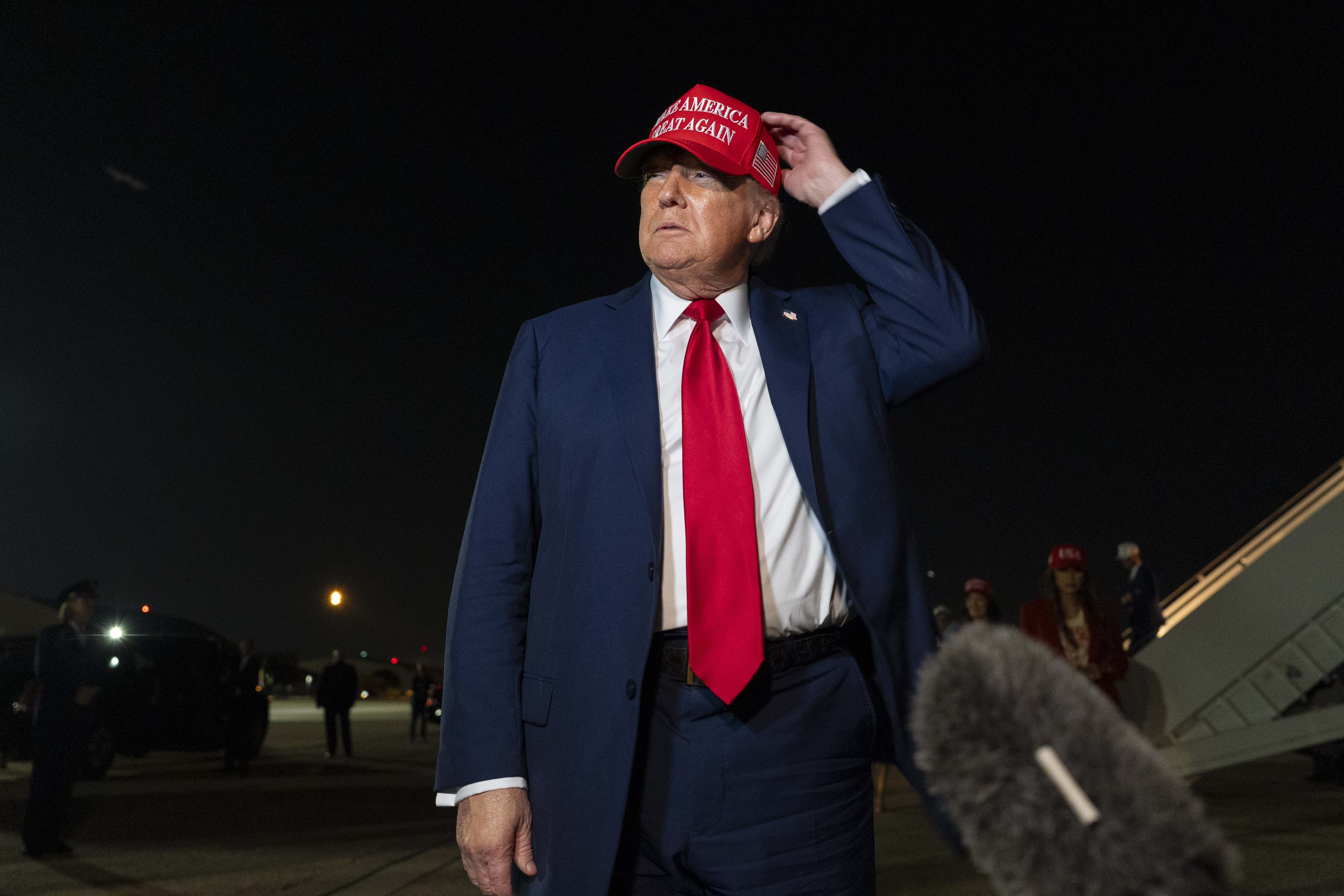 President Donald Trump speaks with reporters as he arrives on Air Force One, Friday, July 4, 2025, at Joint Base Andrews, Md. (AP Photo/Alex Brandon)