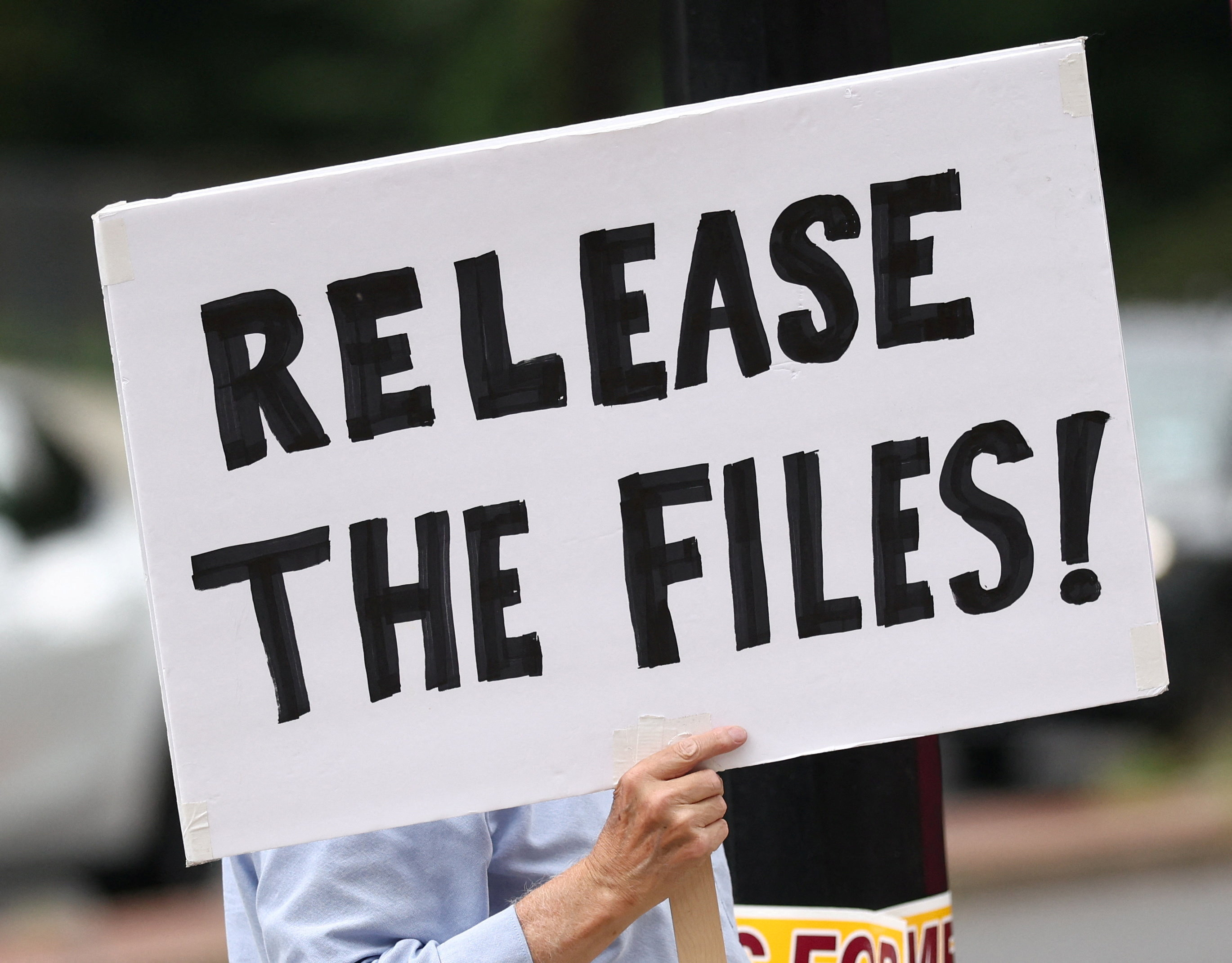 A sign calling for the release of the Epstein files