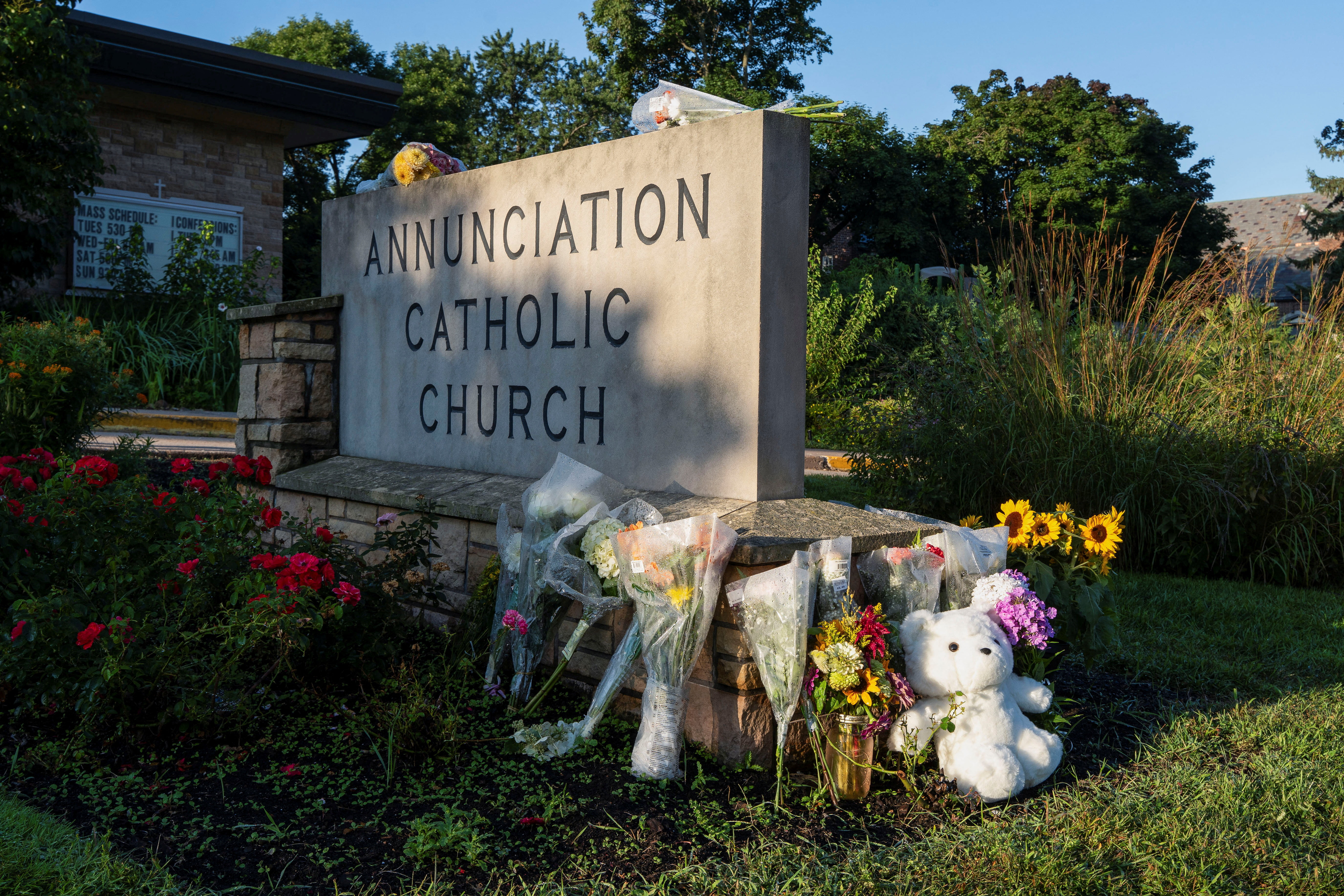 Flowers and a stuffed animal sit outside the Annunciation Church, which is a home to an elementary school and was the scene of a shooting the day before, in Minneapolis, Minnesota, U.S. August 28, 2025. REUTERS/Tim Evans