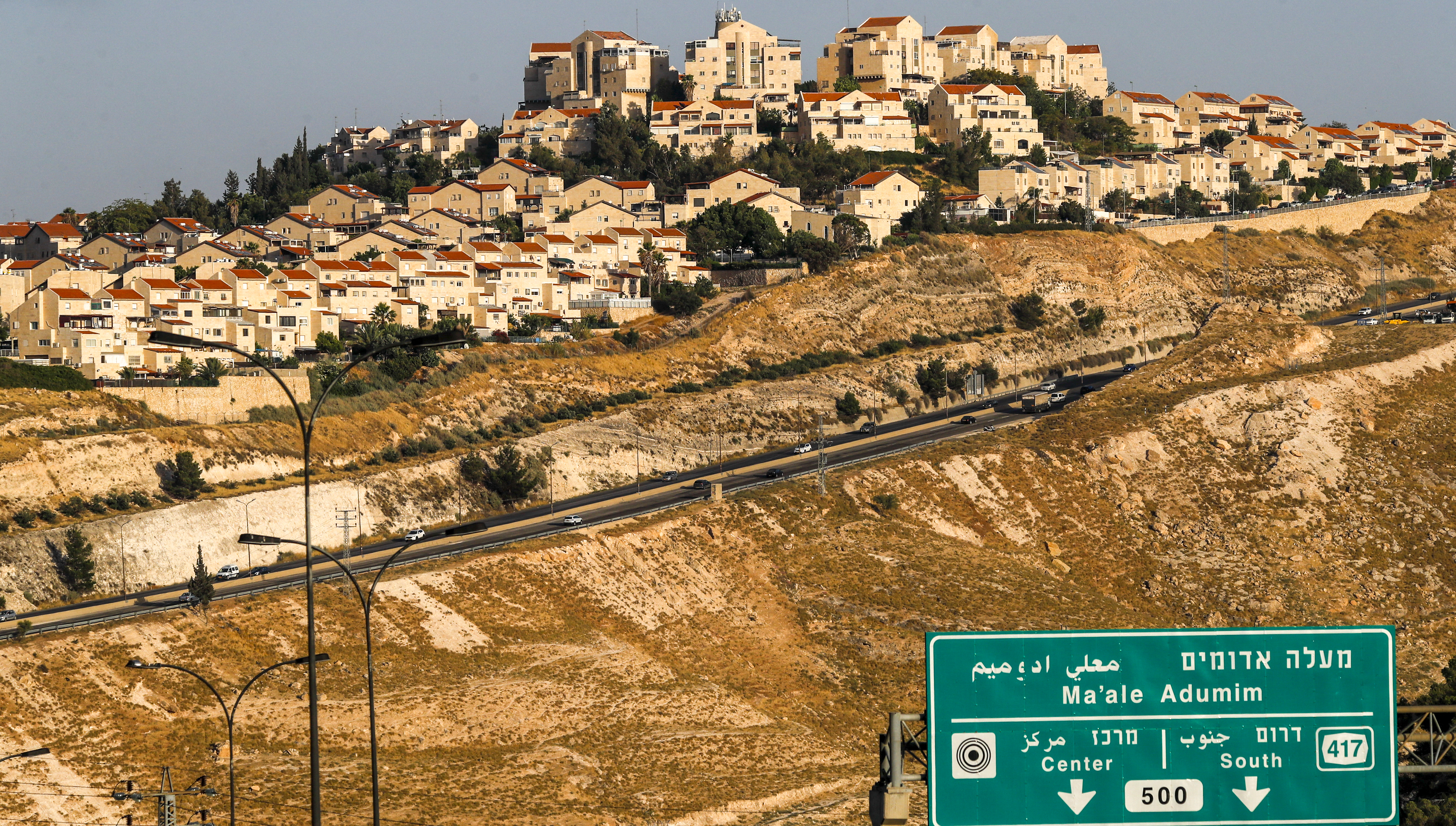 A picture taken from the E1 corridor, a super-sensitive area of the occupied West Bank, shows Israeli settlement of Maale Adumim in the background on June 16, 2020. (Photo by AHMAD GHARABLI / AFP)