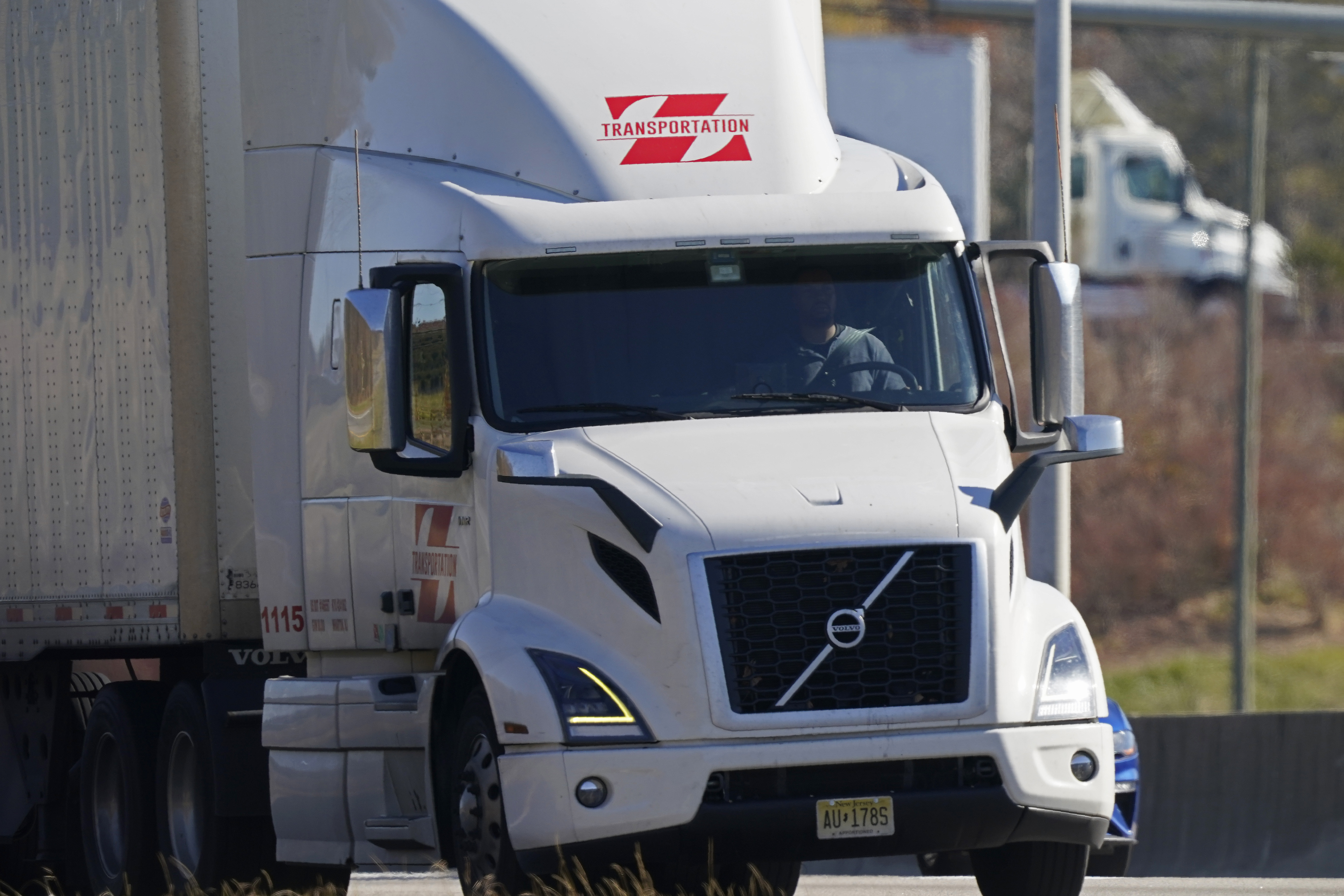 Truckers use Interstate 40 near Mebane, N.C., Tuesday, Nov. 30, 2021. Global supply chain shortages continue as high demand has brought goods shortages to the U.S. and much of the world. (AP Photo/Gerry Broome)