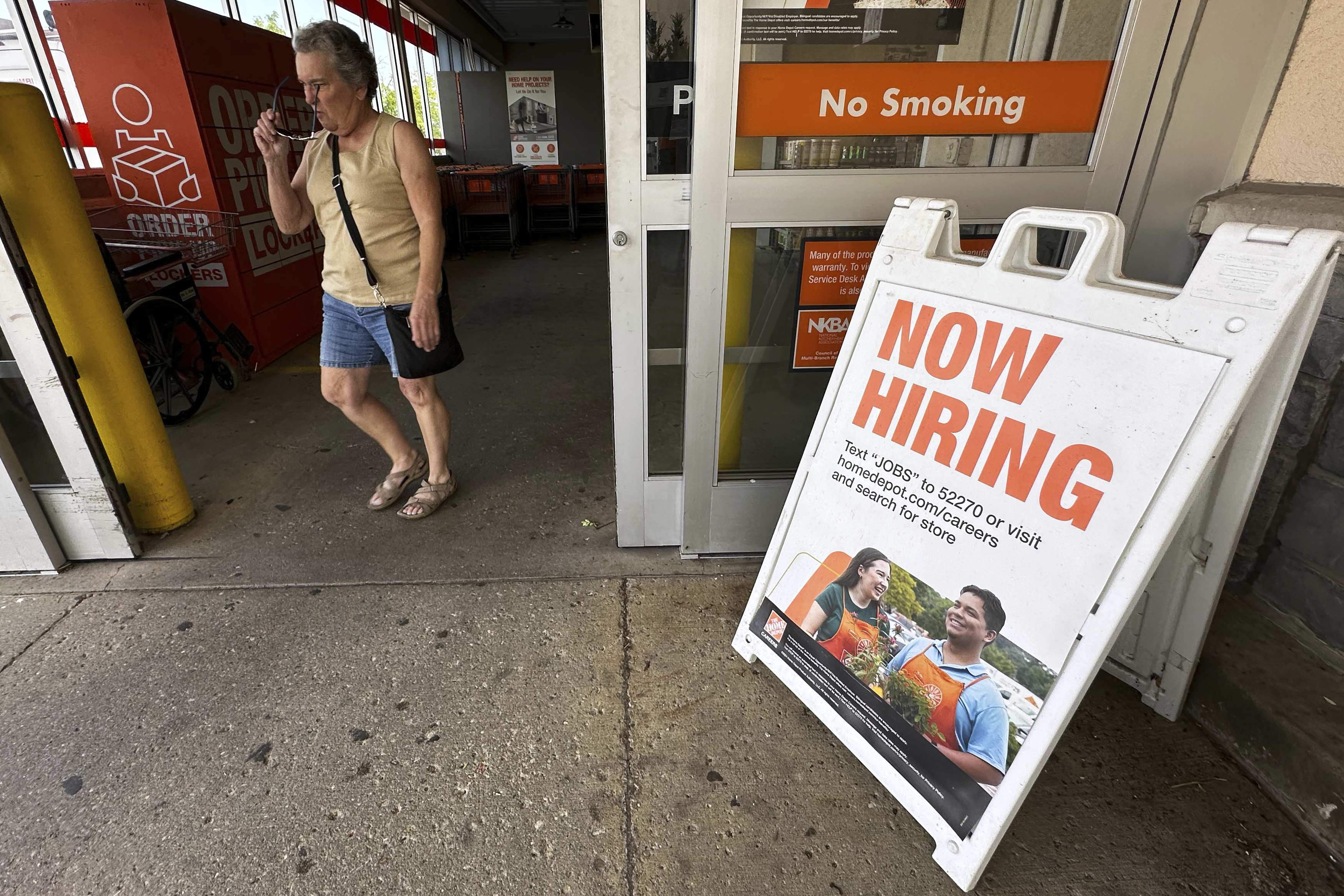 Now hiring sign is displayed at a retail store in Vernon Hills, Ill., Thursday, August. 7, 2025. (AP Photo/Nam Y. Huh)