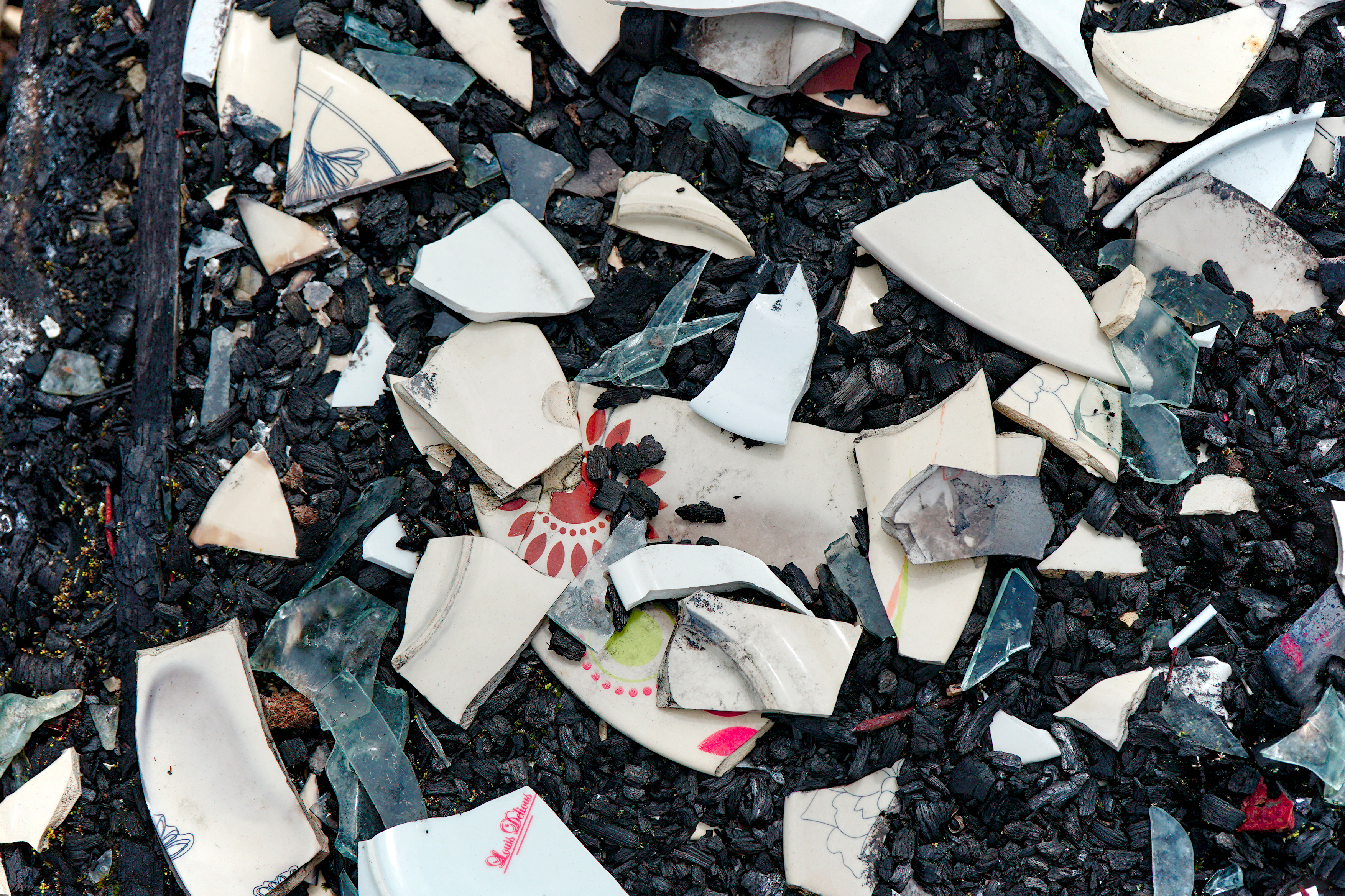 Shards of china lie on the ground at the Rio Blanco site.