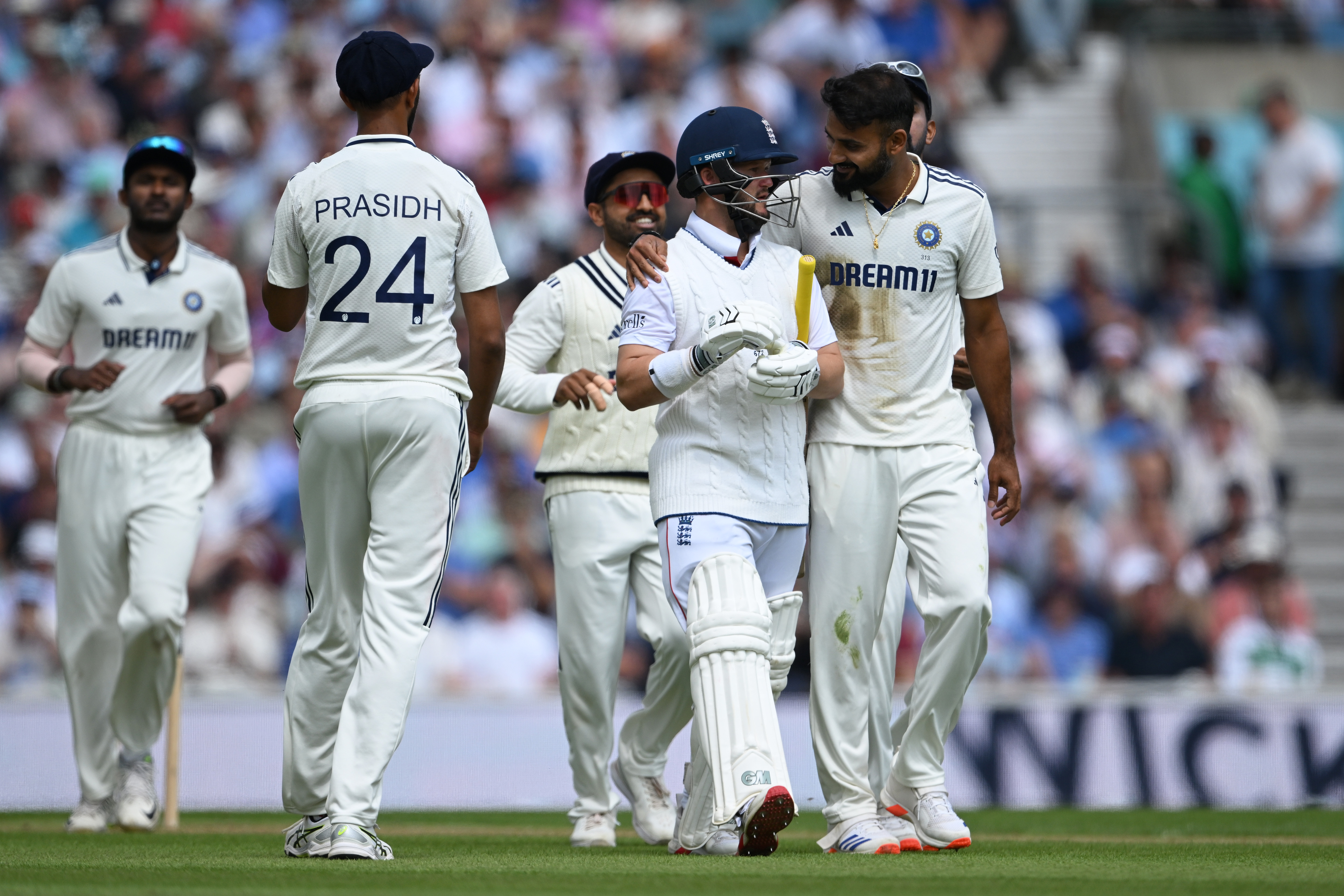 Akash Deep of India puts his arm around Ben Duckett of England after dismissing him for 43