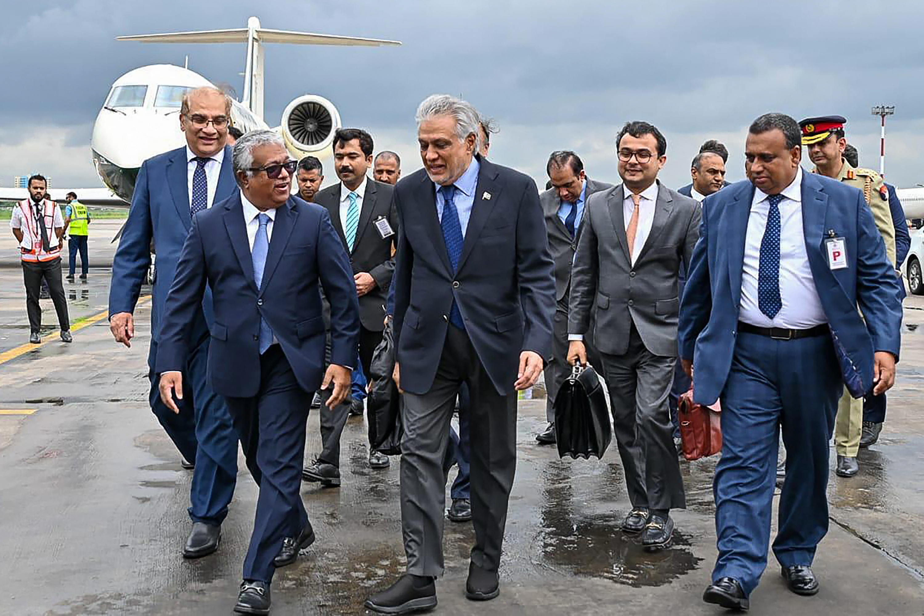Bangladesh's Foreign Secretary Asad Alam Siam receives Pakistan's Foreign Minister Ishaq Dar at Dhaka airport