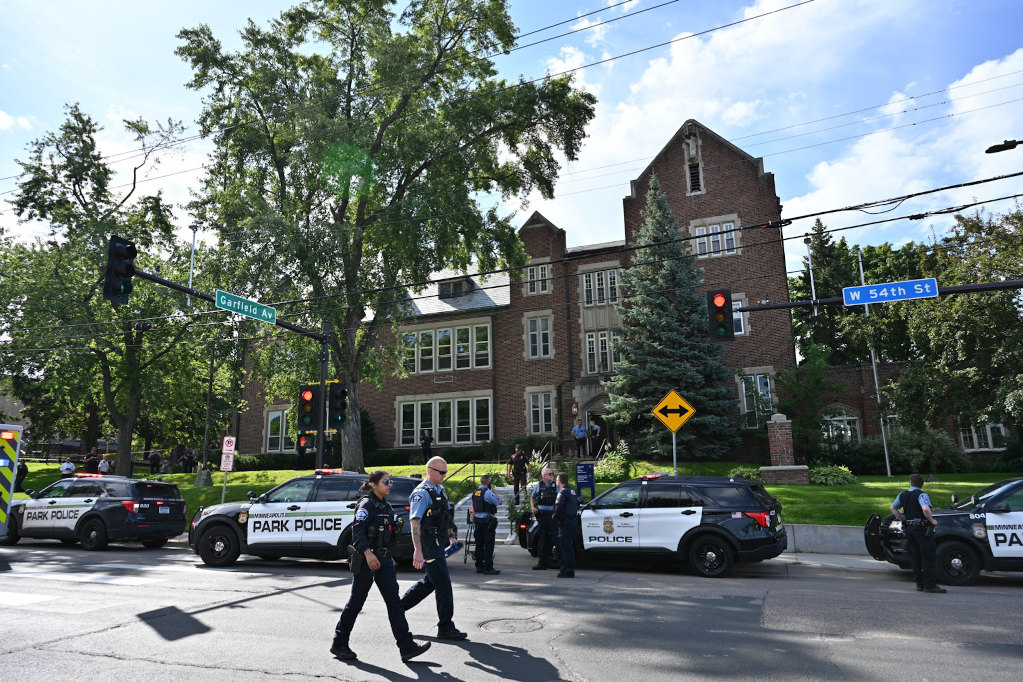 Police and first responders at the scene of a shooting near Annunciation Church and Catholic School in Minneapolis, Minnesota