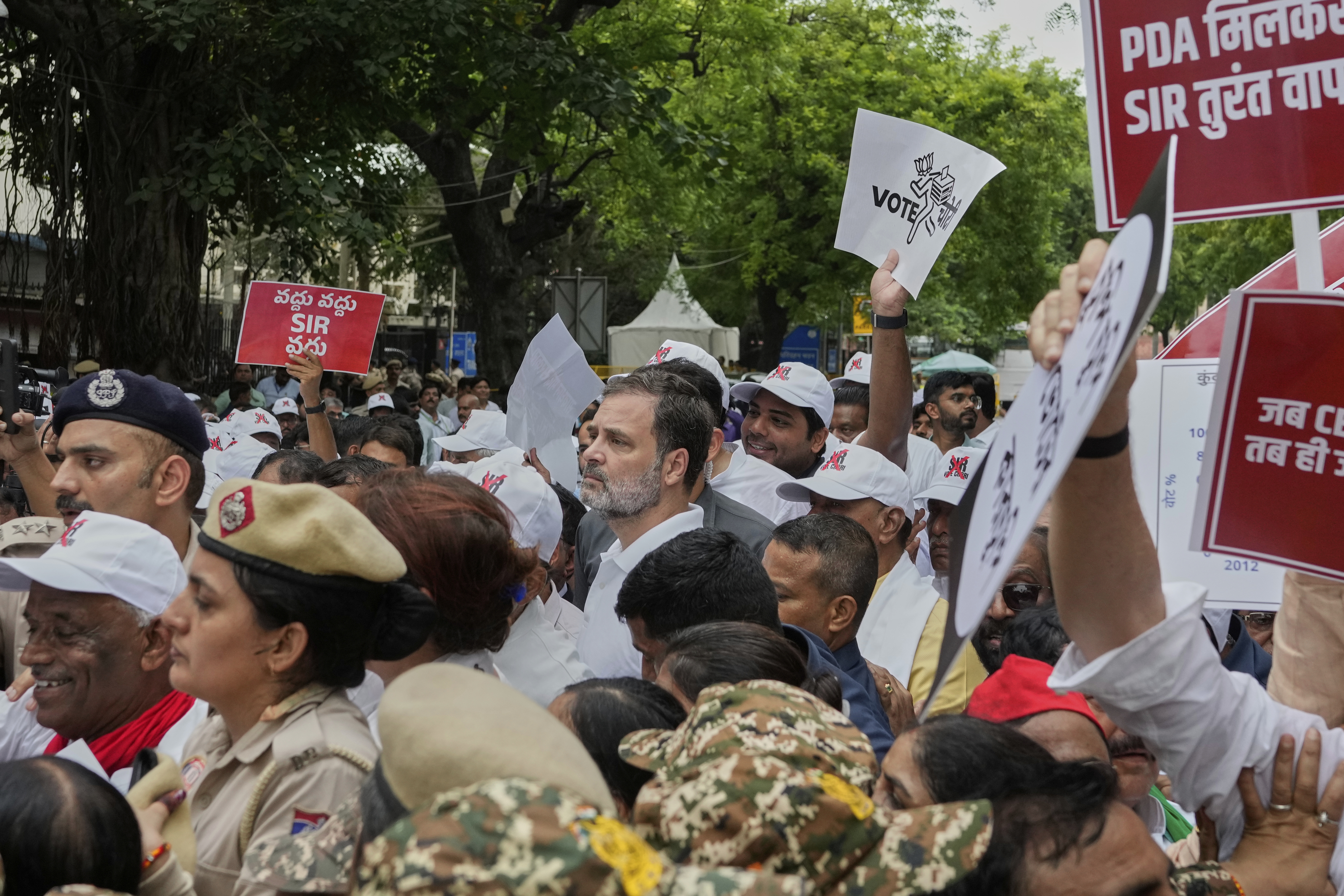Congress party leader and leader of opposition Rahul Gandhi, center, and other parties lawmakers are stopped by police during a protest calling for the rollback of a controversial revision of the voter list in one of the country’s poorest states where key elections are scheduled in November, in New Delhi, India, Monday, Aug. 11, 2025. (AP Photo/Manish Swarup)