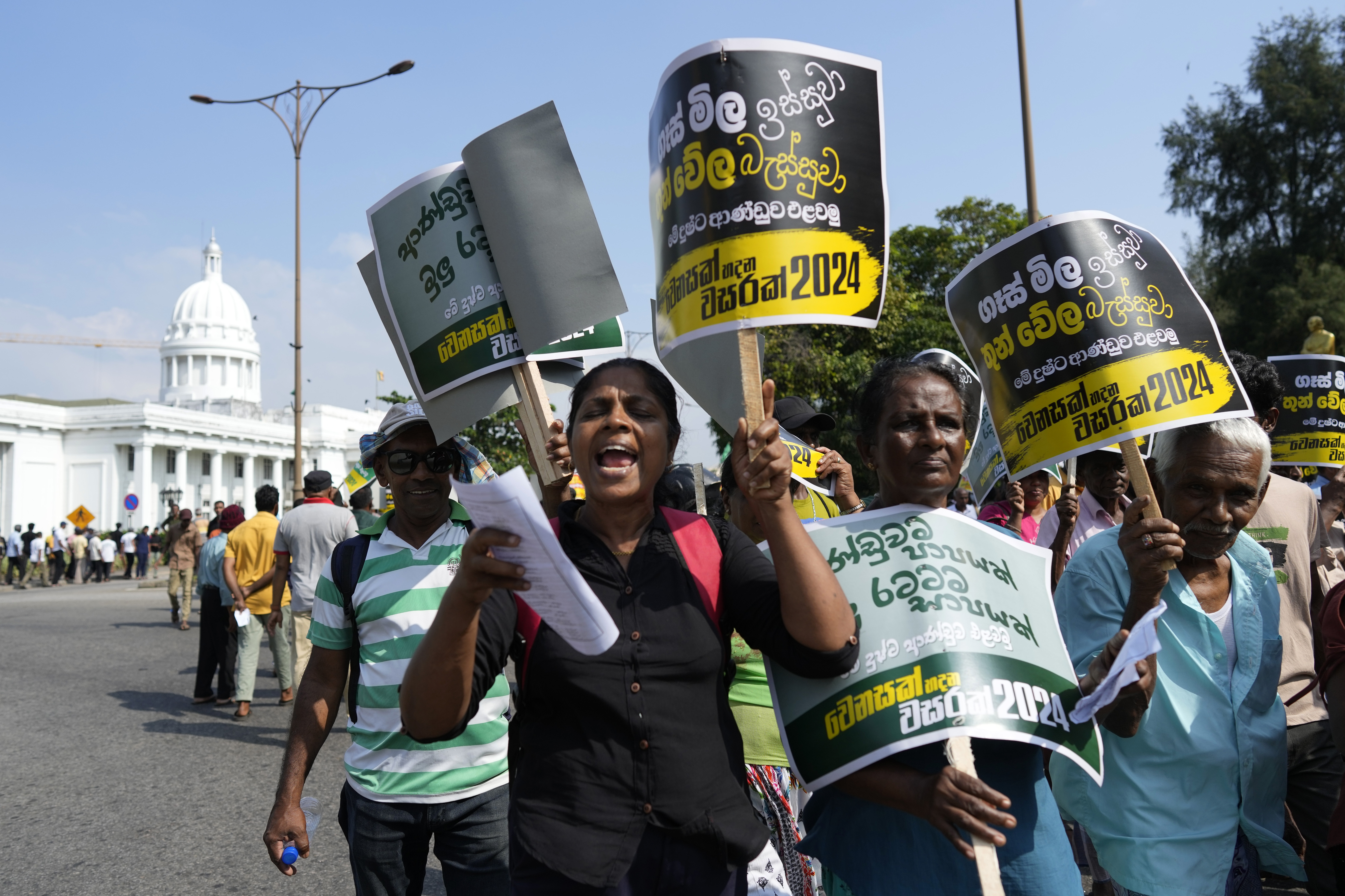 Supporters of Sri Lanka's main opposition shout slogans during a protest rally against high taxes and increases in electricity and fuel charges, in Colombo, Sri Lanka, Tuesday, Jan. 30, 2024. (AP Photo/Eranga Jayawardena)