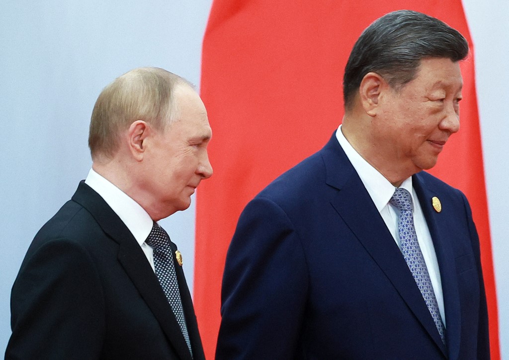 Russia's President Vladimir Putin (L) walks with China's President Xi Jinping during the Shanghai Cooperation Organisation summit in Tianjin on September 1, 2025. [Vladimir Smirnov/AFP]