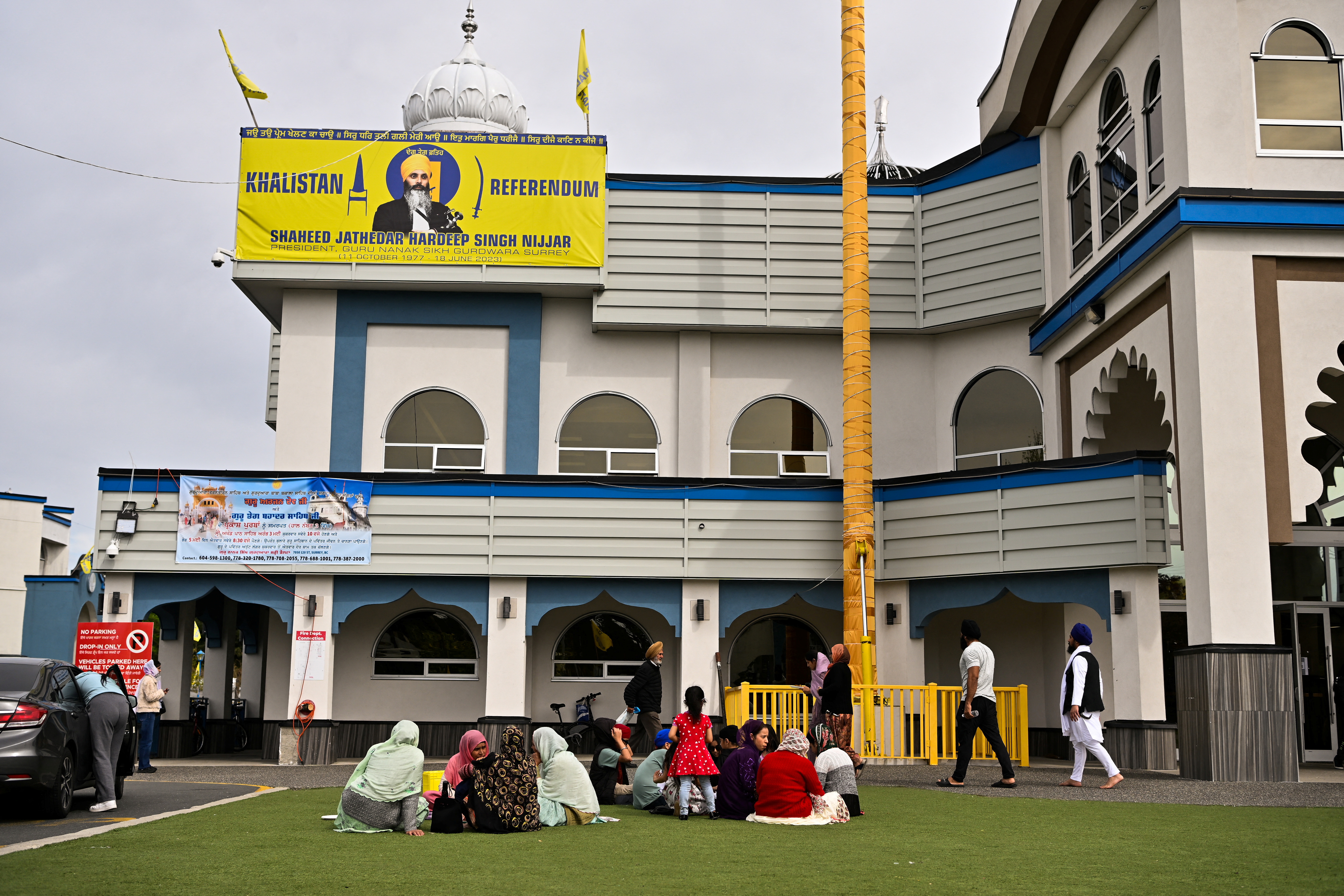 People gather at Guru Nanak Sikh Gurdwara, site of the 2023 murder of Sikh separatist leader Hardeep Singh Nijjar, in Surrey, British Columbia, Canada May 3, 2024. REUTERS/Jennifer Gauthier