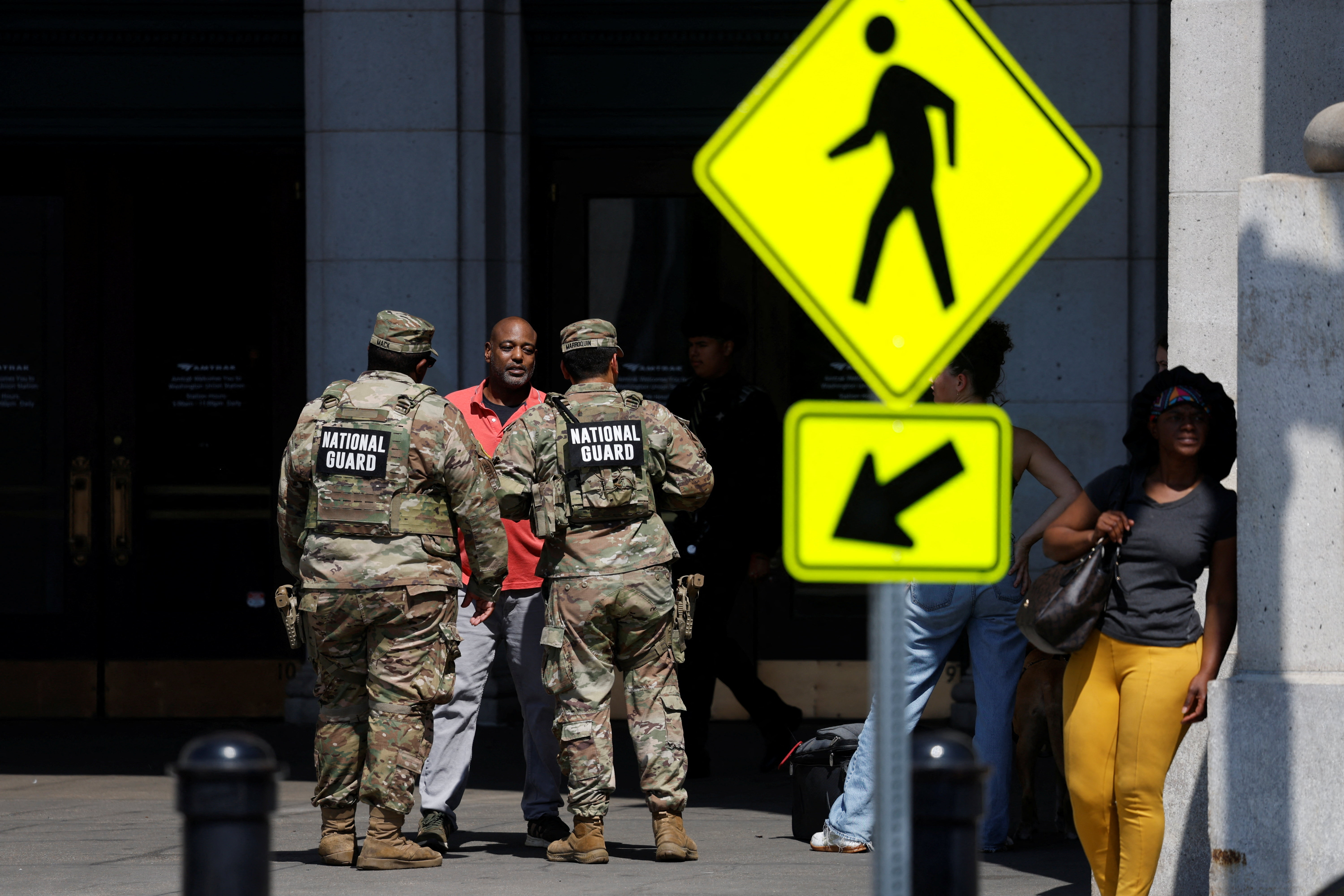 Members of the National Guard patrol outside Union Station, weeks after U.S. President Donald Trump deployed the National Guard and ordered an increased presence of federal law enforcement to assist in crime prevention, in Washington, D.C., U.S., September 15, 2025. REUTERS/Daniel Becerril