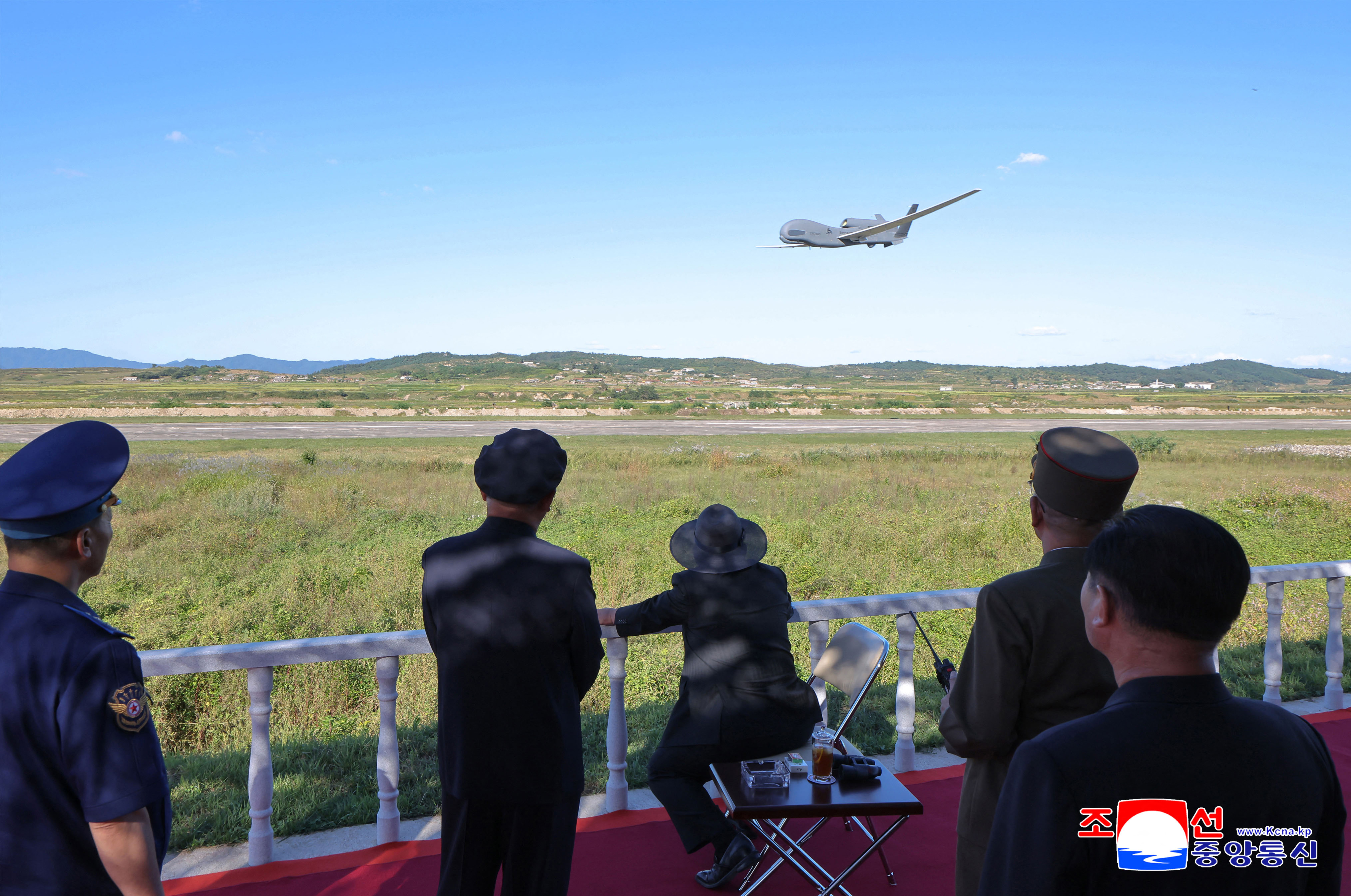 This picture taken on September 18, 2025 and released from North Korea's official Korean Central News Agency (KCNA) via KNS on September 19, 2025 shows North Korea's leader Kim Jong Un (C) leading the performance test of an unmanned strategic reconnaissance aircraft at an undisclosed location in North Korea. North Korean leader Kim Jong Un oversaw a drone performance test and emphasised the importance of using artificial intelligence (AI) in drones, state media said on September 19. (Photo by KCNA VIA KNS / AFP) / South Korea OUT / SOUTH KOREA OUT / SOUTH KOREA OUT / REPUBLIC OF KOREA OUT ---EDITORS NOTE--- RESTRICTED TO EDITORIAL USE - MANDATORY CREDIT "AFP PHOTO/KCNA VIA KNS" - NO MARKETING NO ADVERTISING CAMPAIGNS - DISTRIBUTED AS A SERVICE TO CLIENTS / THIS PICTURE WAS MADE AVAILABLE BY A THIRD PARTY. AFP CAN NOT INDEPENDENTLY VERIFY THE AUTHENTICITY, LOCATION, DATE AND CONTENT OF THIS IMAGE --- /