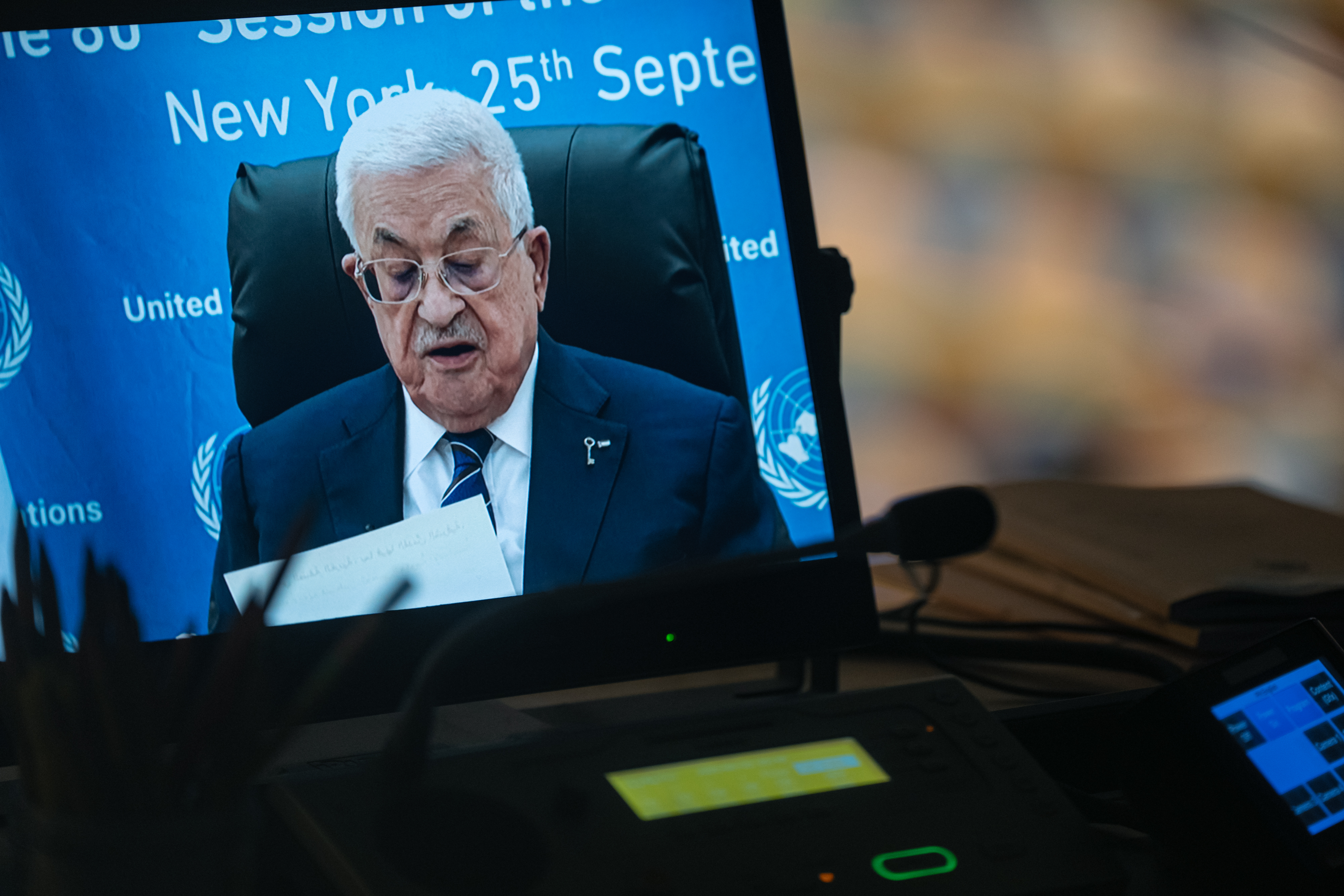 Mahmoud Abbas on a screen delivering remarks to the UNGA