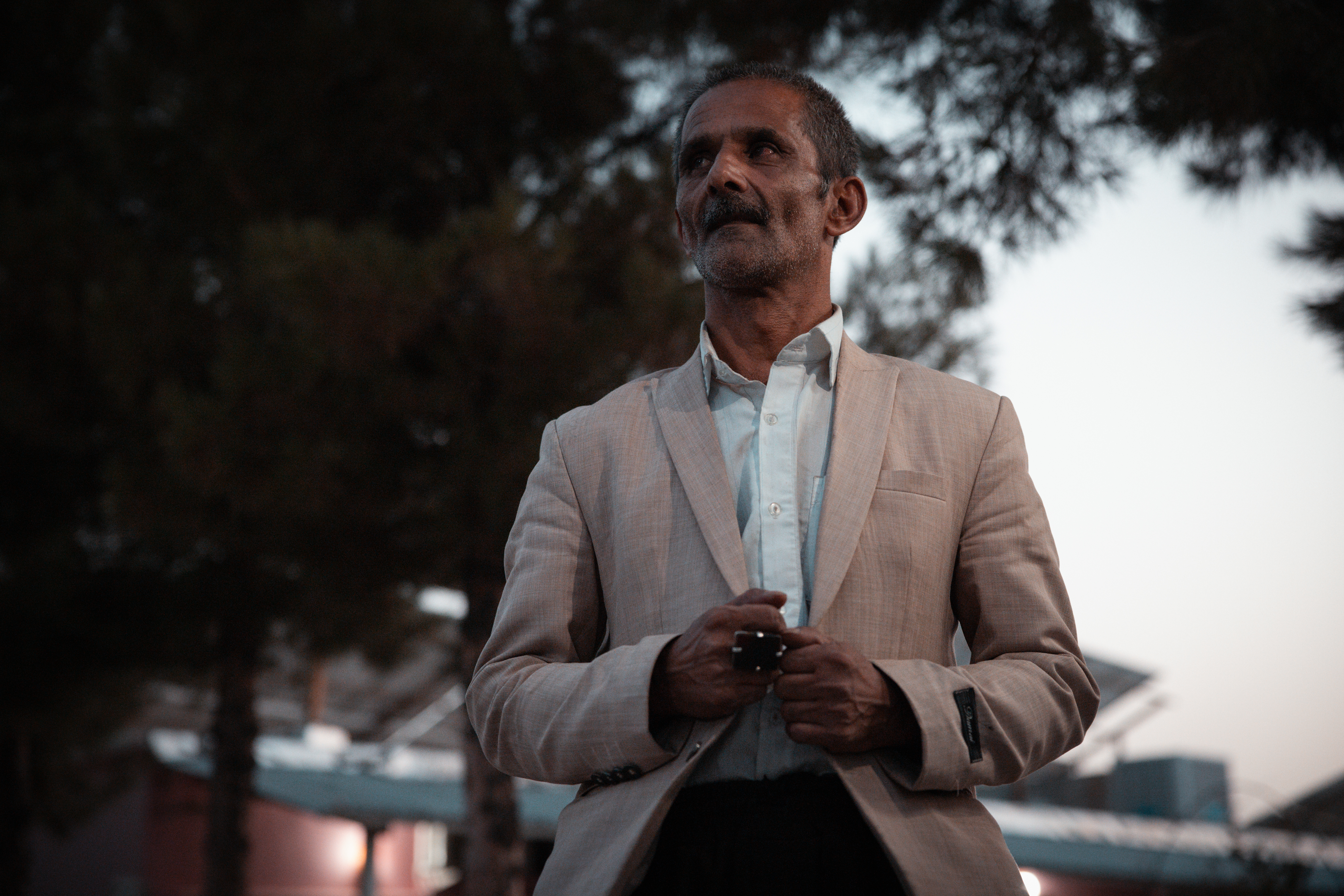 Noor Ahmad spent 26 years in Iran, where he ran a small shop. After losing his father, he turned to crystal healing, an alternative therapy he believes can restore mind and body balance through the energy of stones. “Now I have nothing – no tools, no stones, no place to live,” he says. Photo: IOM 2025/Mohammad Osman Azizi