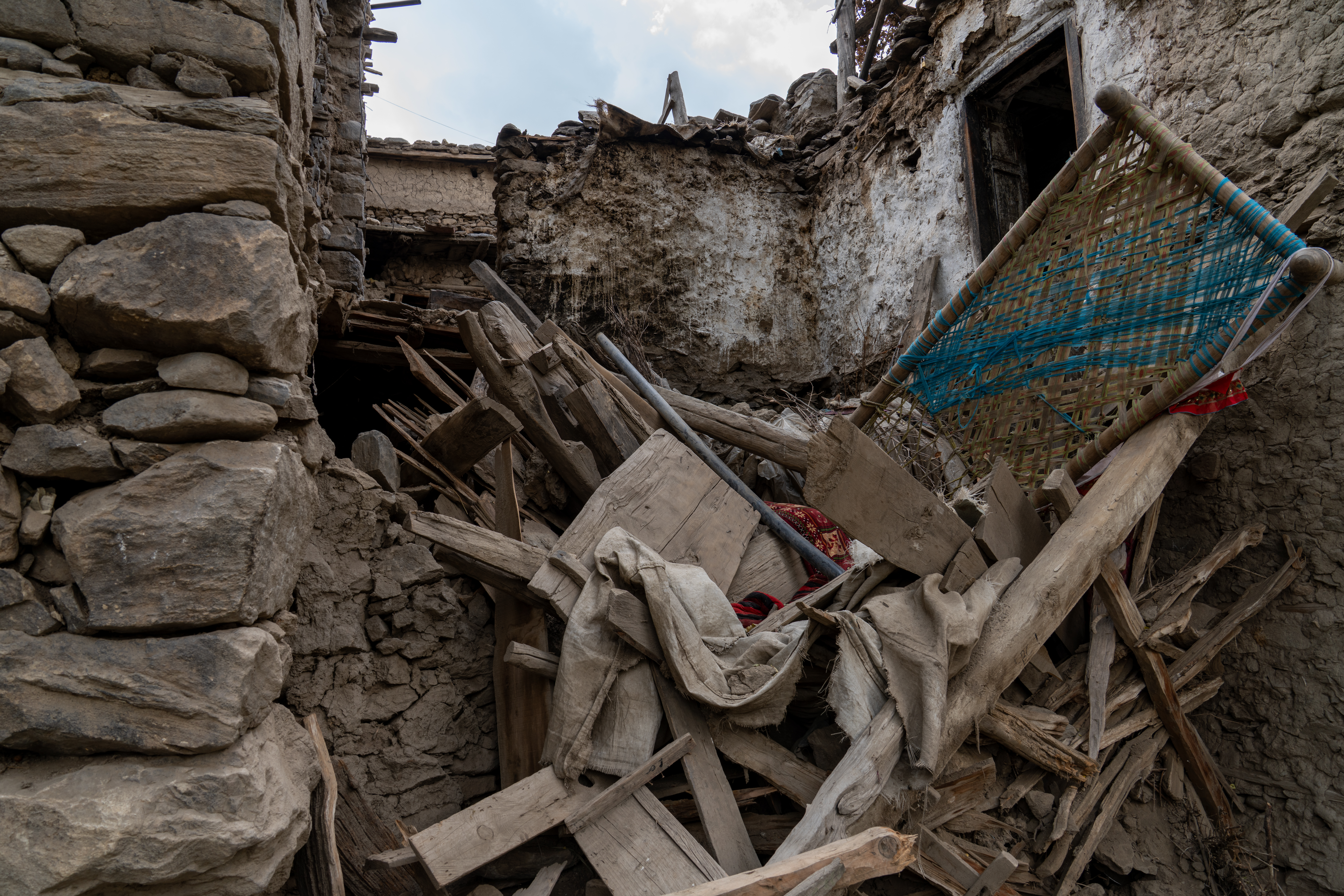 Debris from a collapsed home in Andarlachak village.