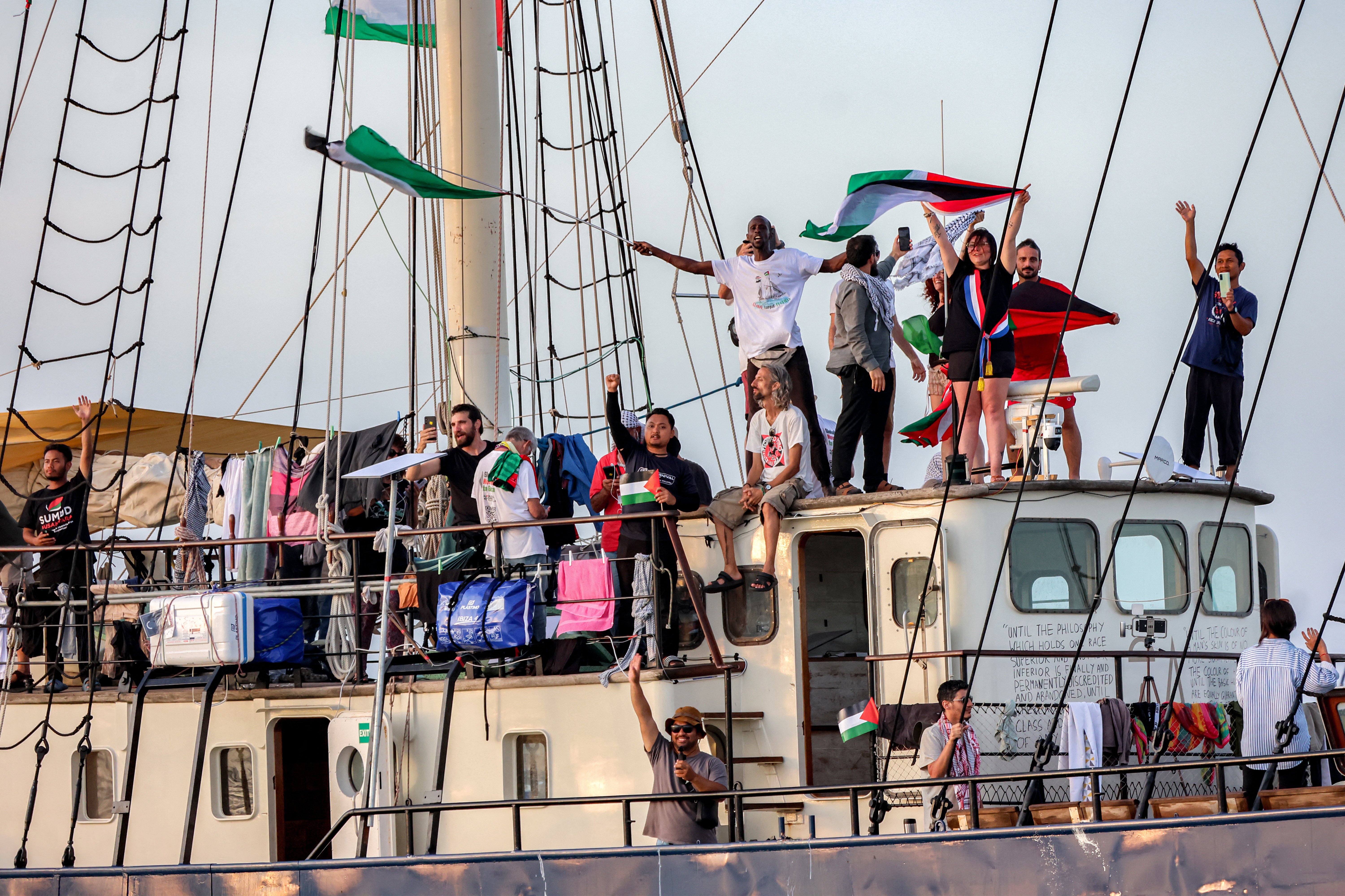 Activists and human rights defenders ride aboard a vessel departing from Tunisia's northern port of Bizerte on September 14, 2025 to join the last boats taking part in the Global Sumud Flotilla, bound for the Gaza Strip to break Israel's blockade on the Palestinian territory.