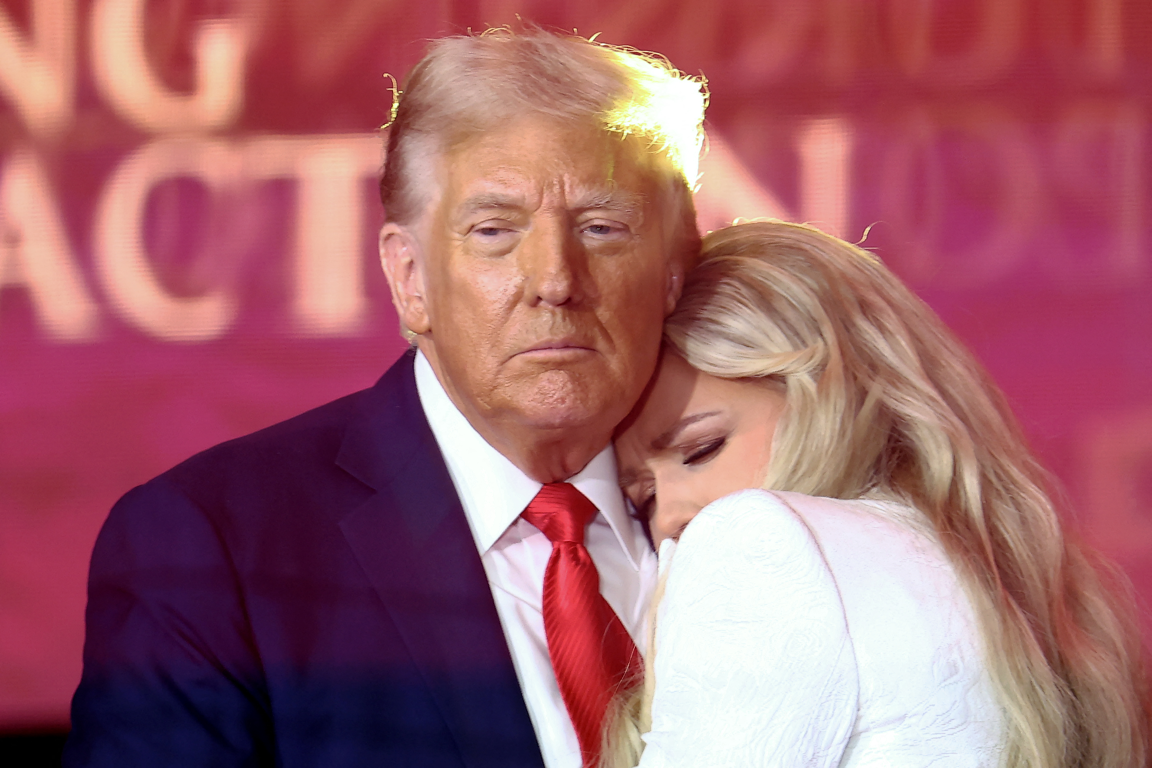 US President Donald Trump greets Erika Kirk, Charlie Kirk's widow, during the public memorial service for right-wing activist Charlie Kirk at State Farm Stadium in Glendale, Arizona, on September 21, 2025. (Photo by CHARLY TRIBALLEAU / AFP)