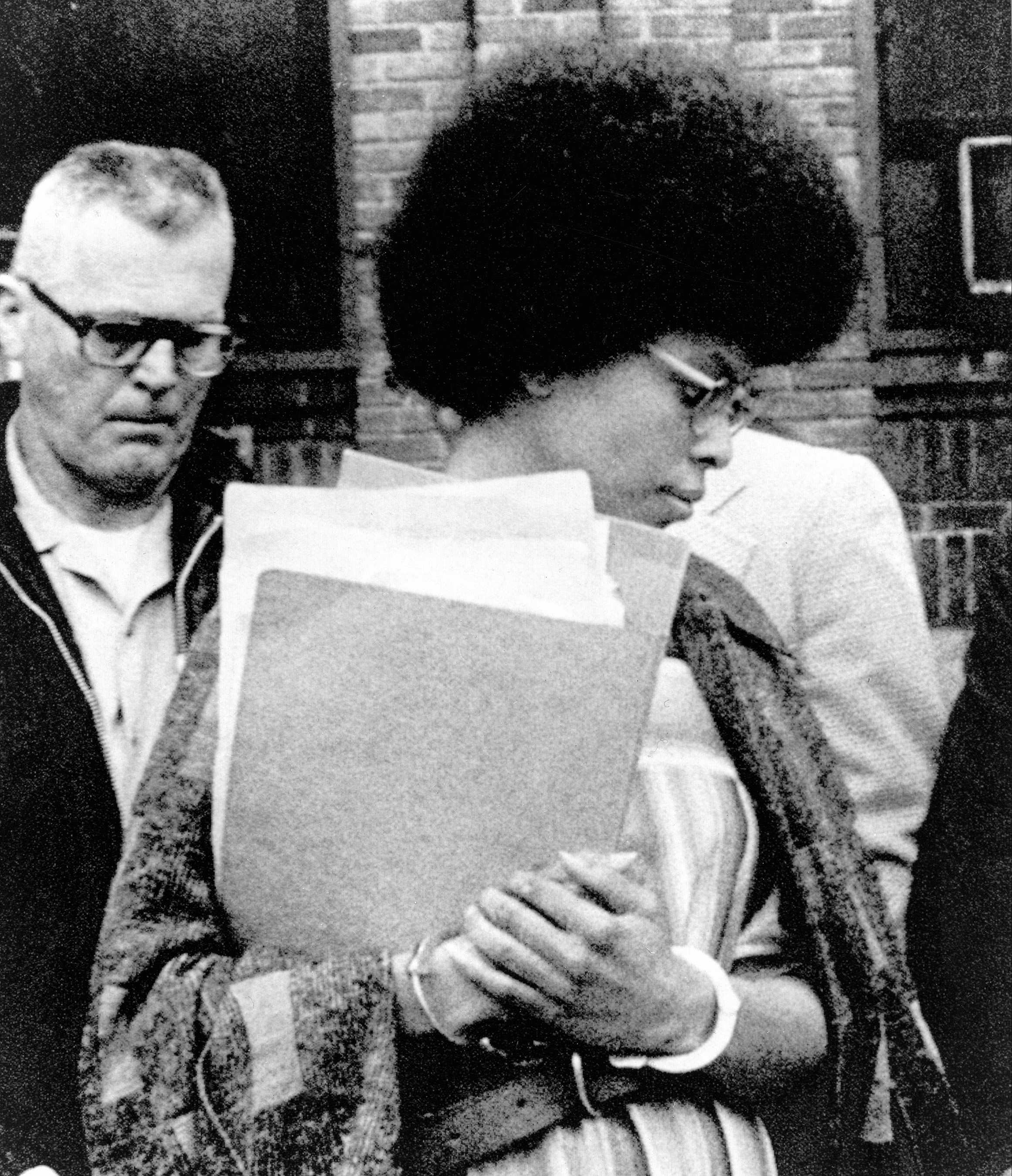 FILE — Joanne Chesimard, a member of the Black Panther Party and Black Liberation Army, leaves Middlesex County courthouse, in New Brunswick, N.J., April 25, 1977.(AP Photo, File)