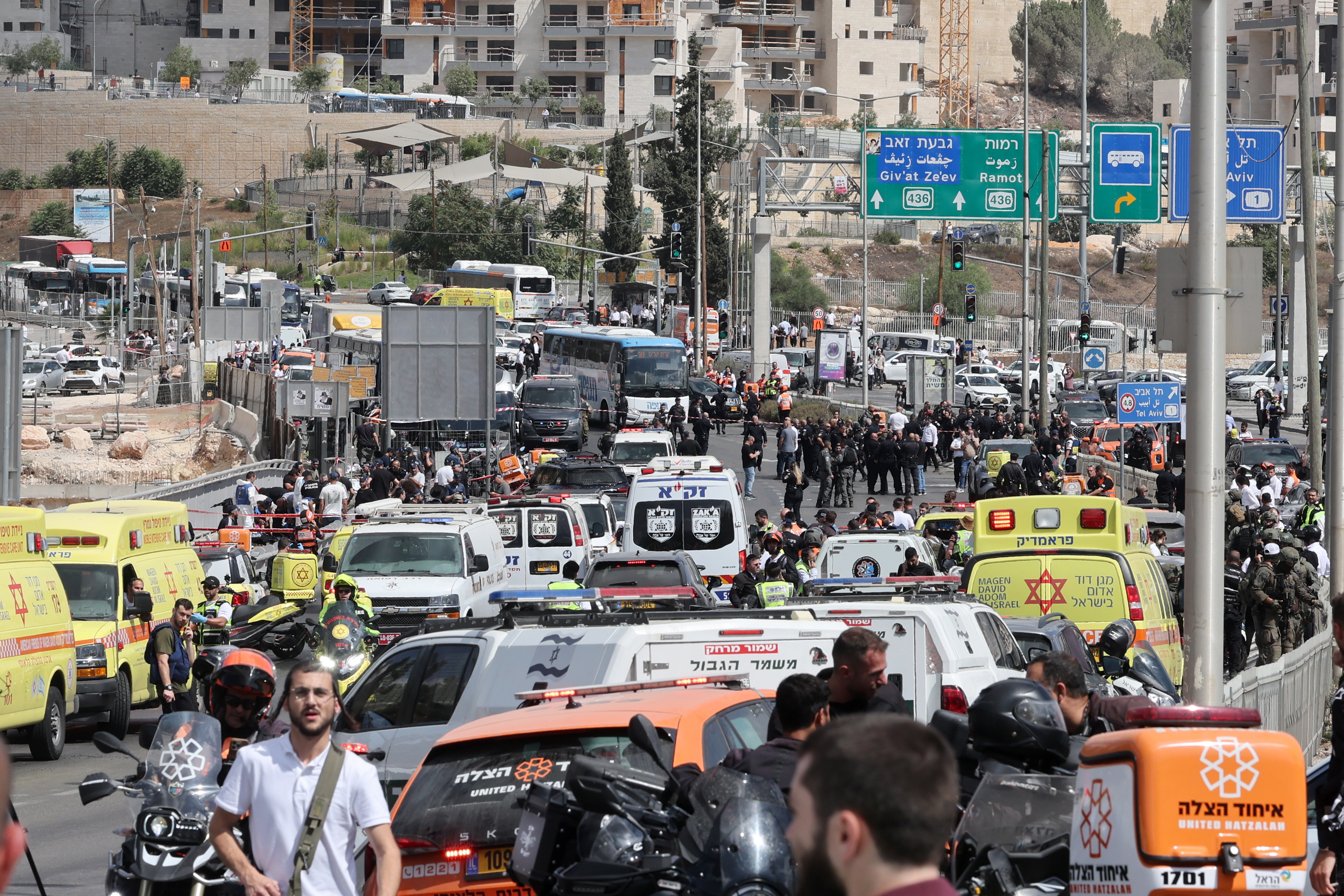 Israeli police and emergency services work at the scene of a shooting incident in occupied East Jerusalem