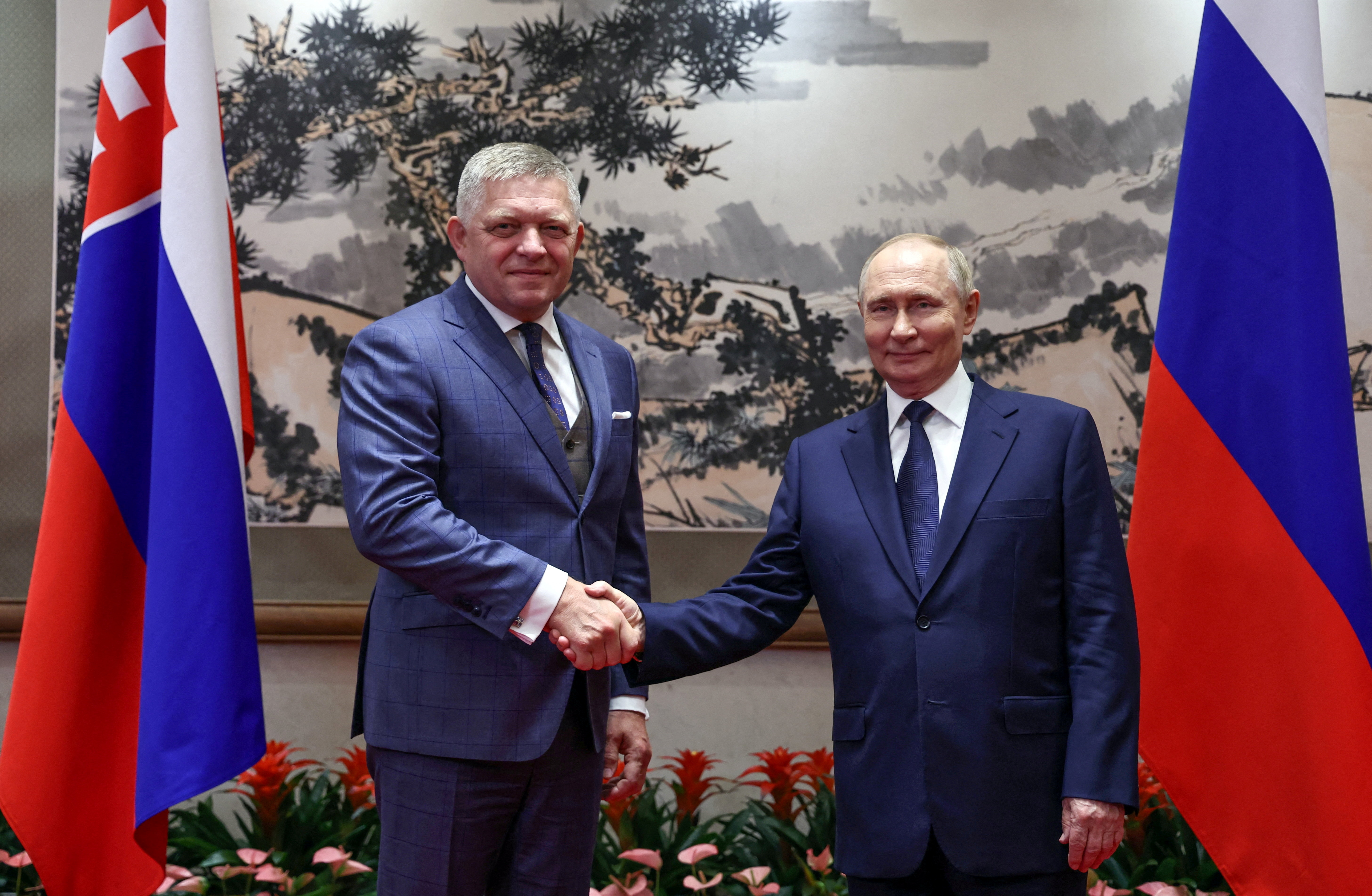 Russian President Vladimir Putin and Slovak Prime Minister Robert Fico pose for a picture during a meeting at Diaoyutai State Guesthouse in Beijing, China September 2, 2025. Sputnik/Alexander Kazakov/Pool via REUTERS ATTENTION EDITORS - THIS IMAGE WAS PROVIDED BY A THIRD PARTY.