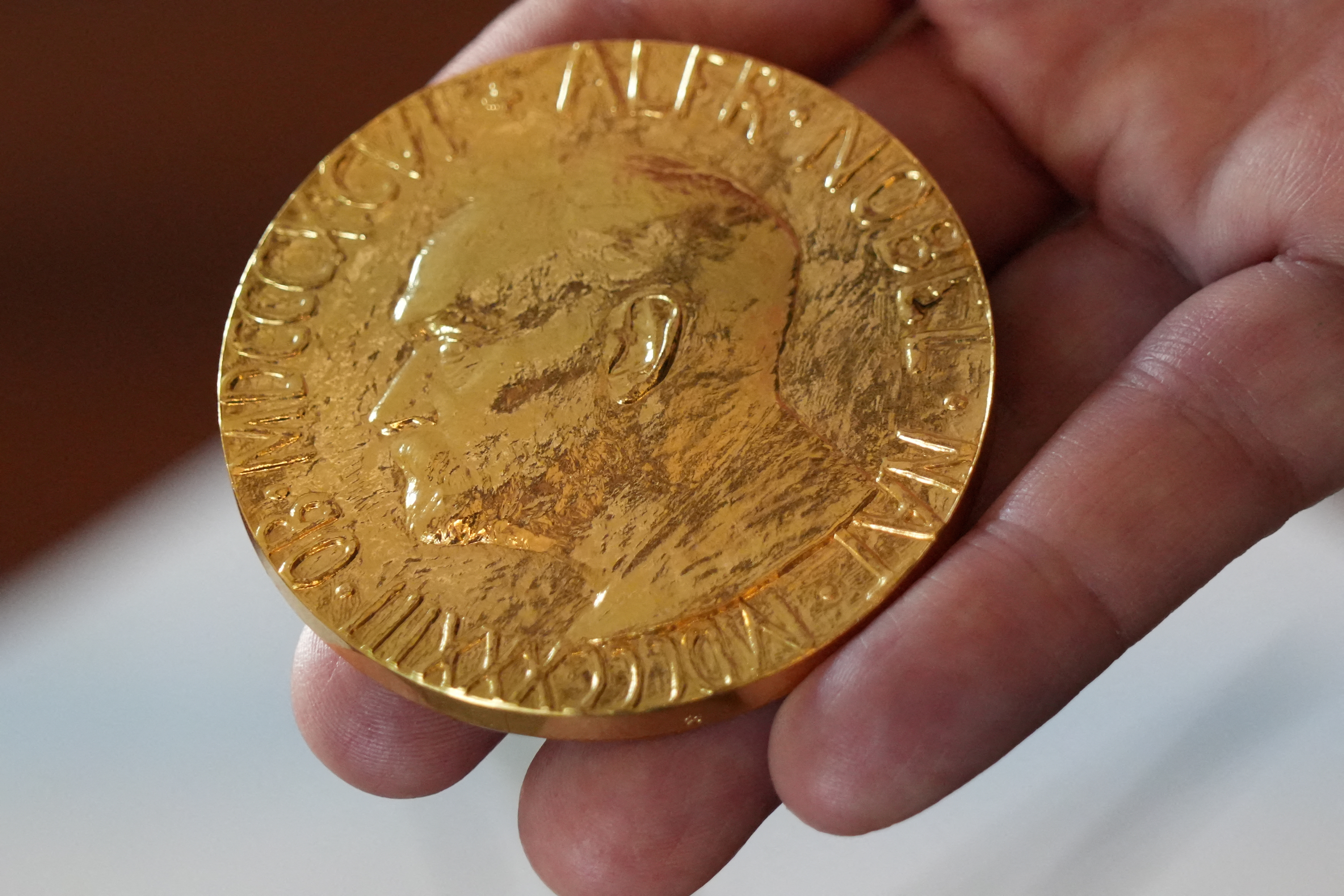 FILE PHOTO: An employee of the Norwegian Nobel Institute holds a replica of a Nobel Peace Medal in the Institute in Oslo, Norway, September 9, 2025