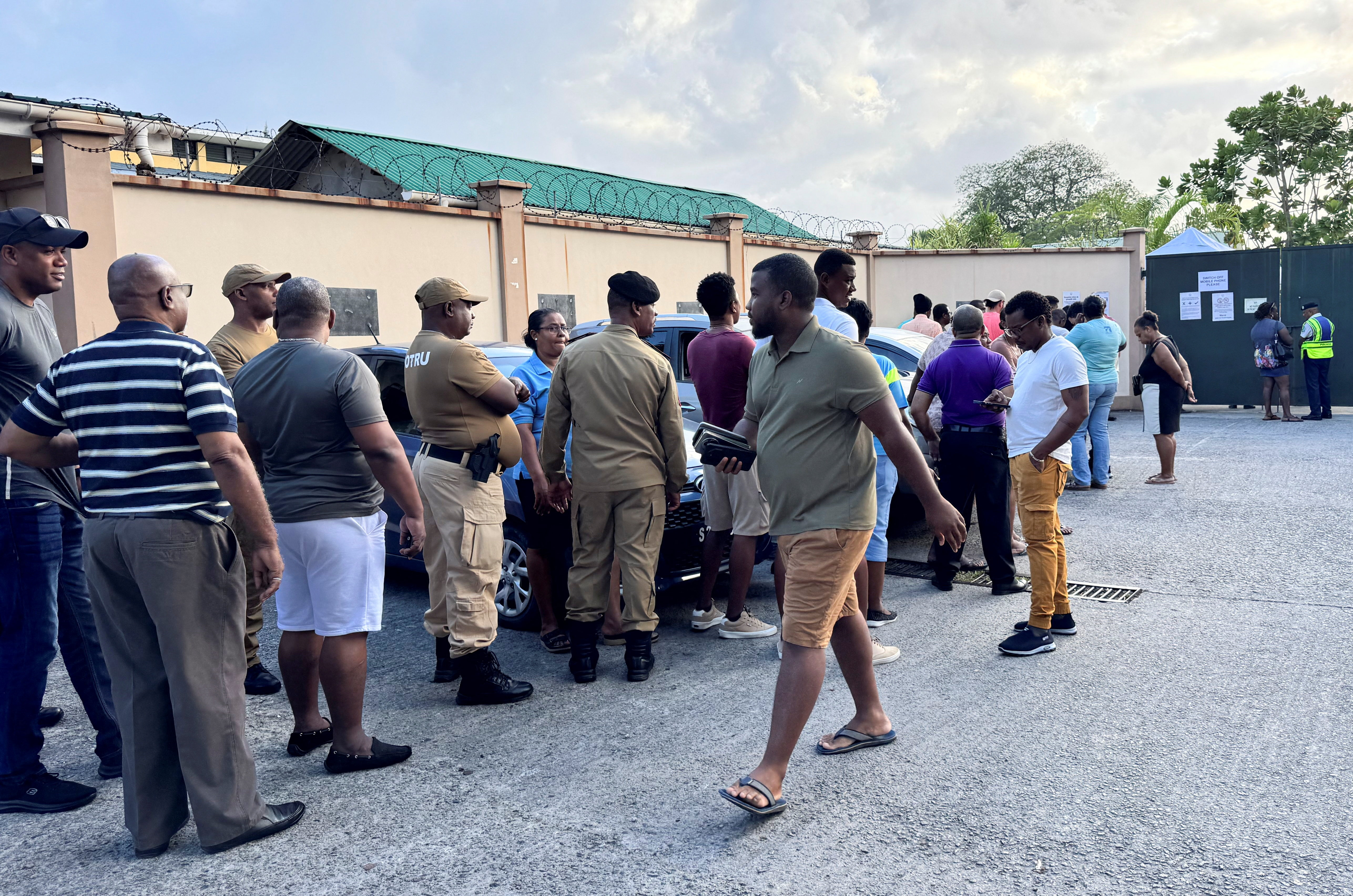 People gather to cast their ballots during the presidential runoff election, after no candidate secured the required 50% majority in the first round held on September 27, in Victoria, Seychelles, October 9, 2025. REUTERS/Gabriel Robert-Gironcelle