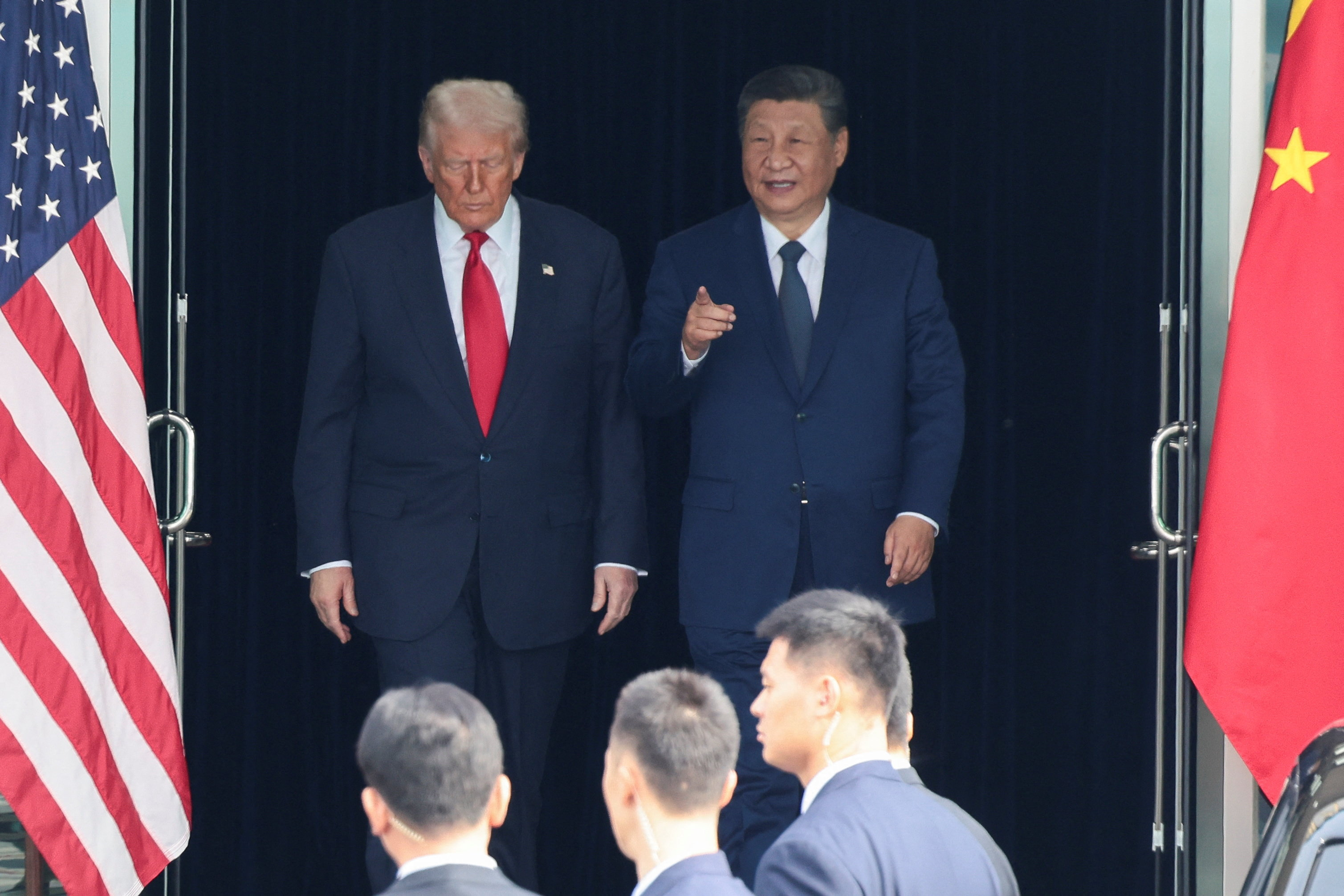 U.S. President Donald Trump and Chinese President Xi Jinping talk as they leave after a bilateral meeting at Gimhae International Airport, on the sidelines of the Asia-Pacific Economic Cooperation (APEC) summit, in Busan, South Korea, October 30, 2025.