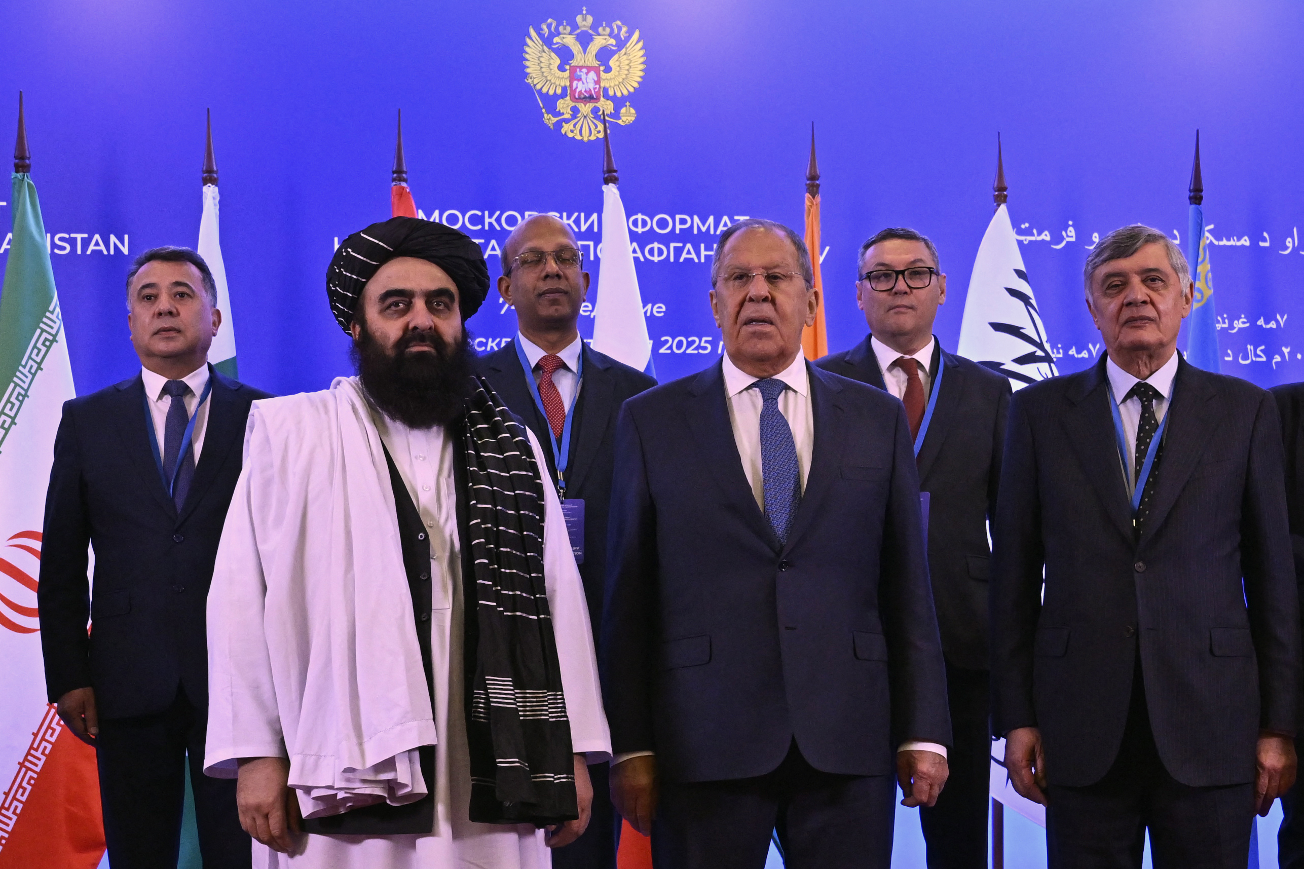 Participants of the Moscow Format Consultations on Afghanistan, including Afghanistan's Foreign Minister Amir Khan Muttaqi, Russian Foreign Minister Sergei Lavrov and Russian presidential envoy to Afghanistan Zamir Kabulov, pose for a family photo prior to the Moscow Format consultations on Afghanistan, in Moscow on October 7, 2025. (Photo by Alexander NEMENOV / AFP)