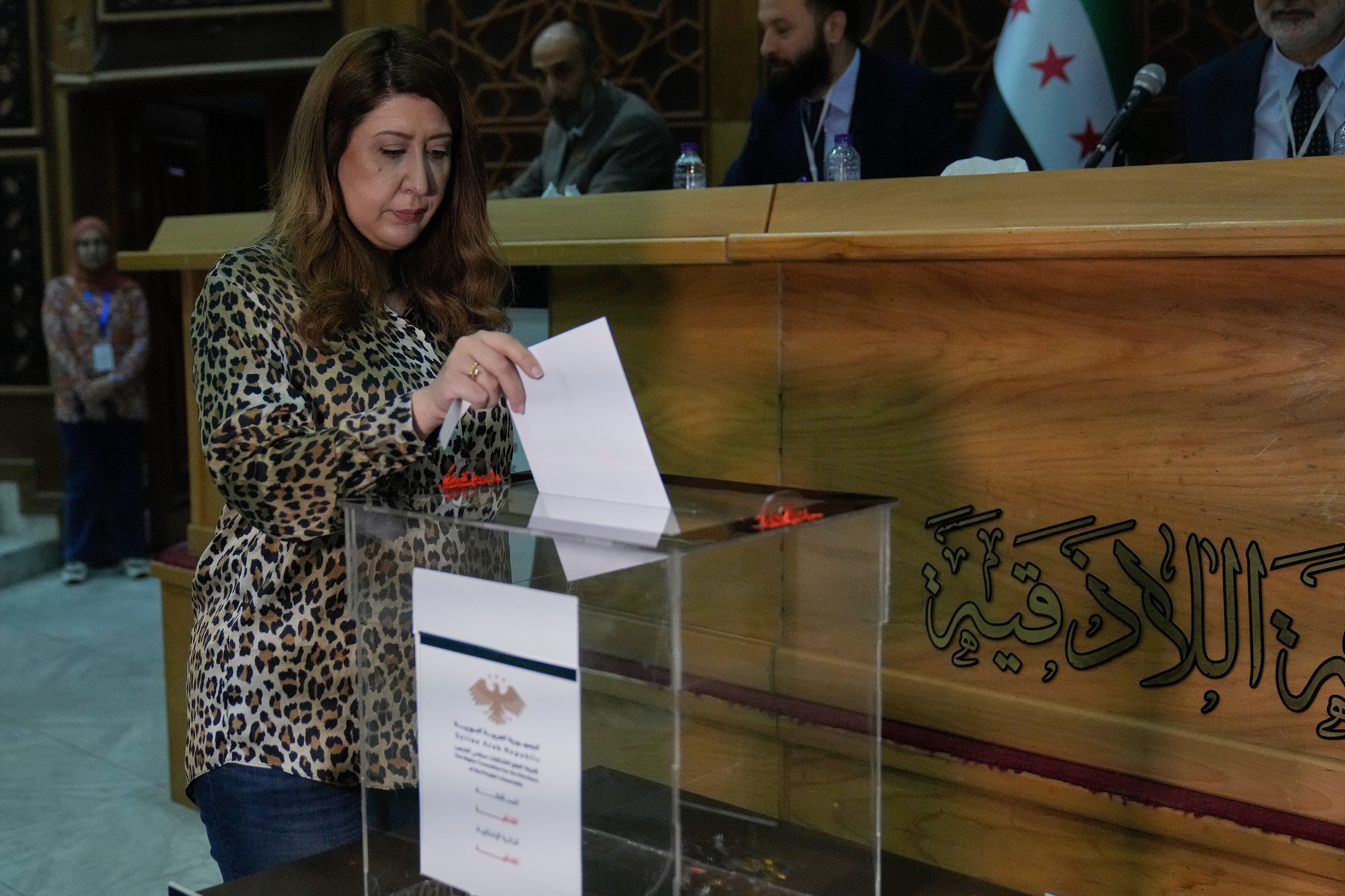Syrian candidate Nahil al-Zarba casts her vote for a parliamentary election at a ballot station in Latakia's Governor building in the coastal city of Latakia, Syria