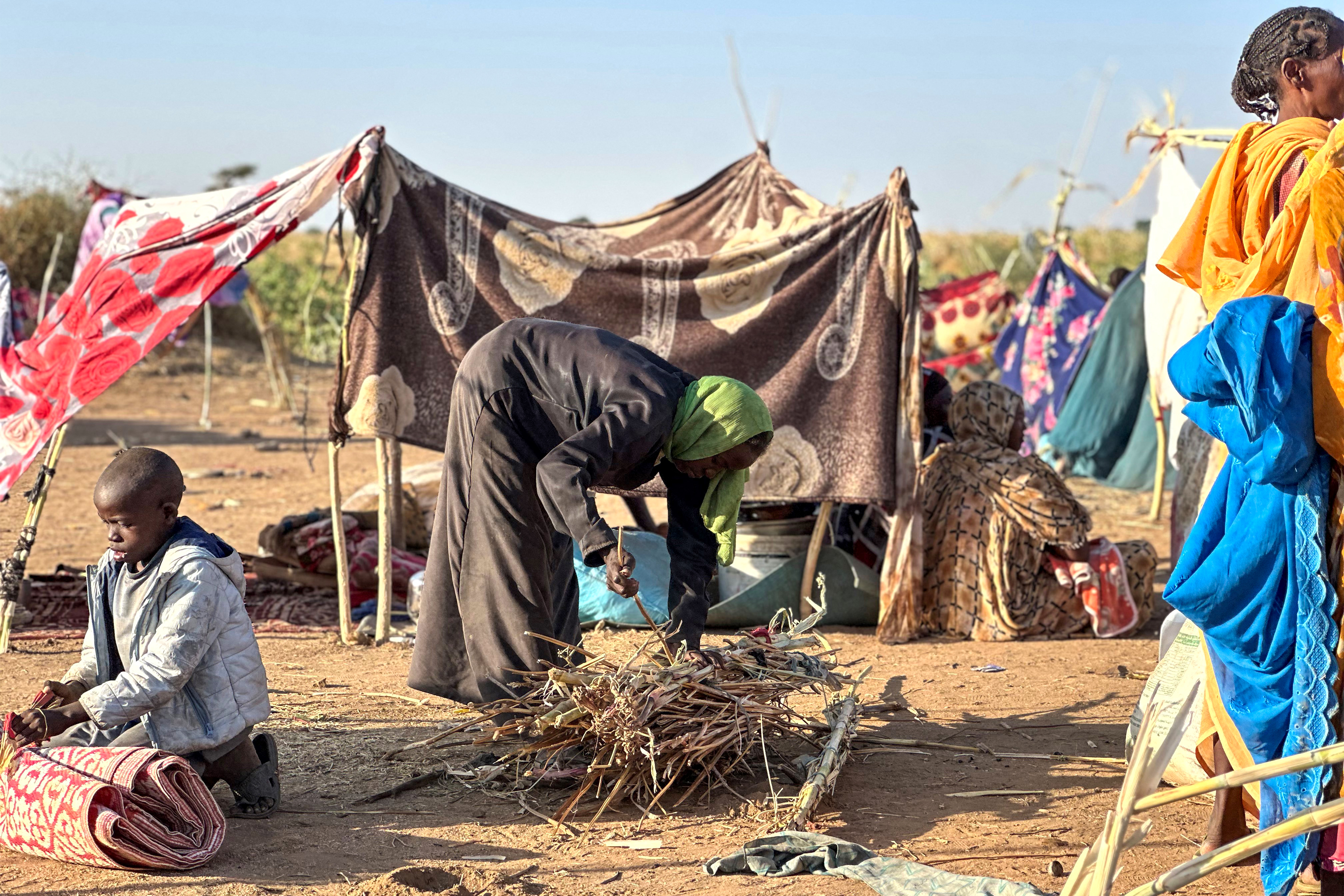 Displaced Sudanese who fled El-Fasher after the city fell to the Rapid Support Forces (RSF), set up camp in the town of Tawila in war-torn Sudan's western Darfur region on October 28, 2025.