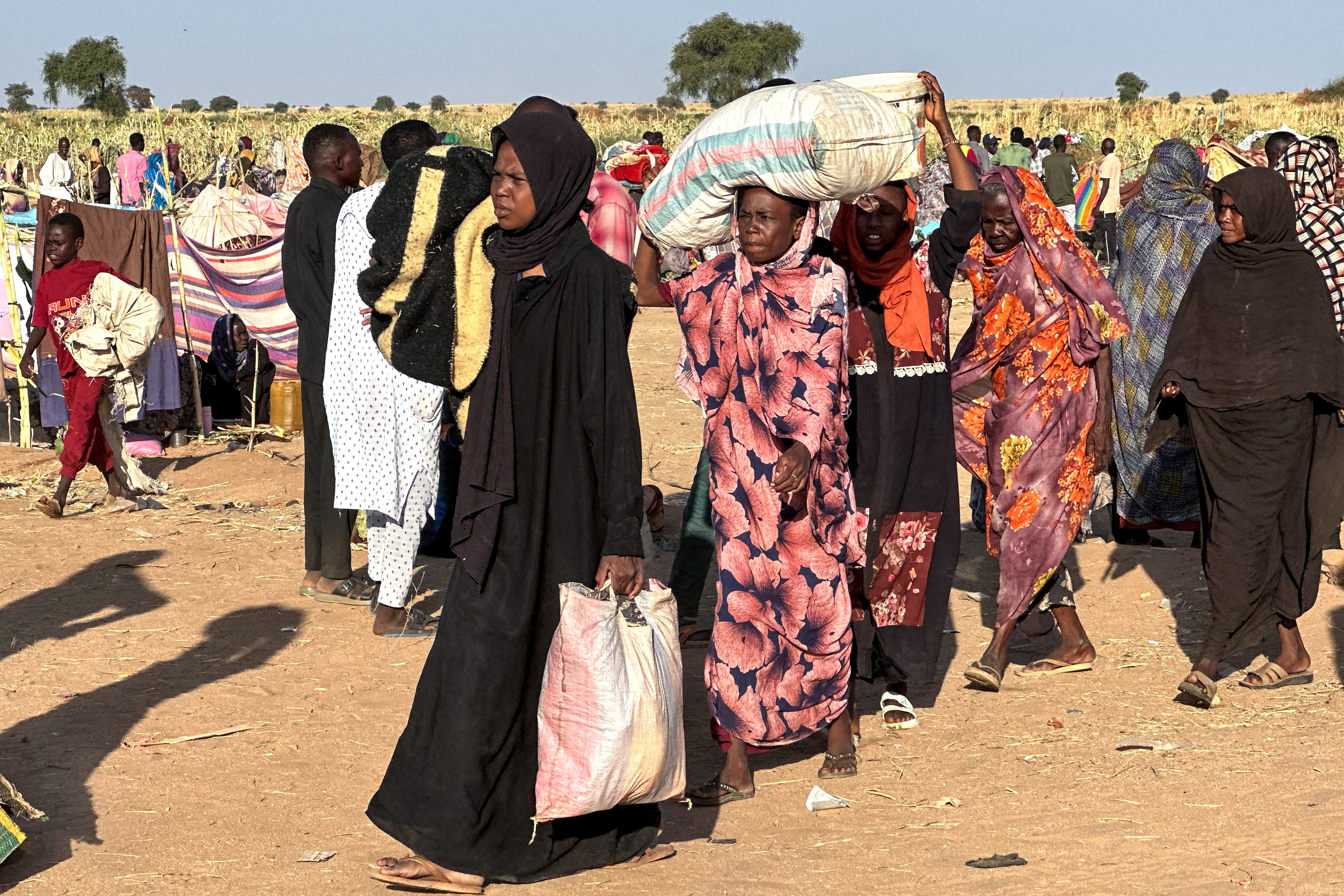Displaced Sudanese who fled El-Fasher after the city fell to the Rapid Support Forces (RSF), arrive in the town of Tawila in war-torn Sudan's western Darfur region on October 28, 2025.