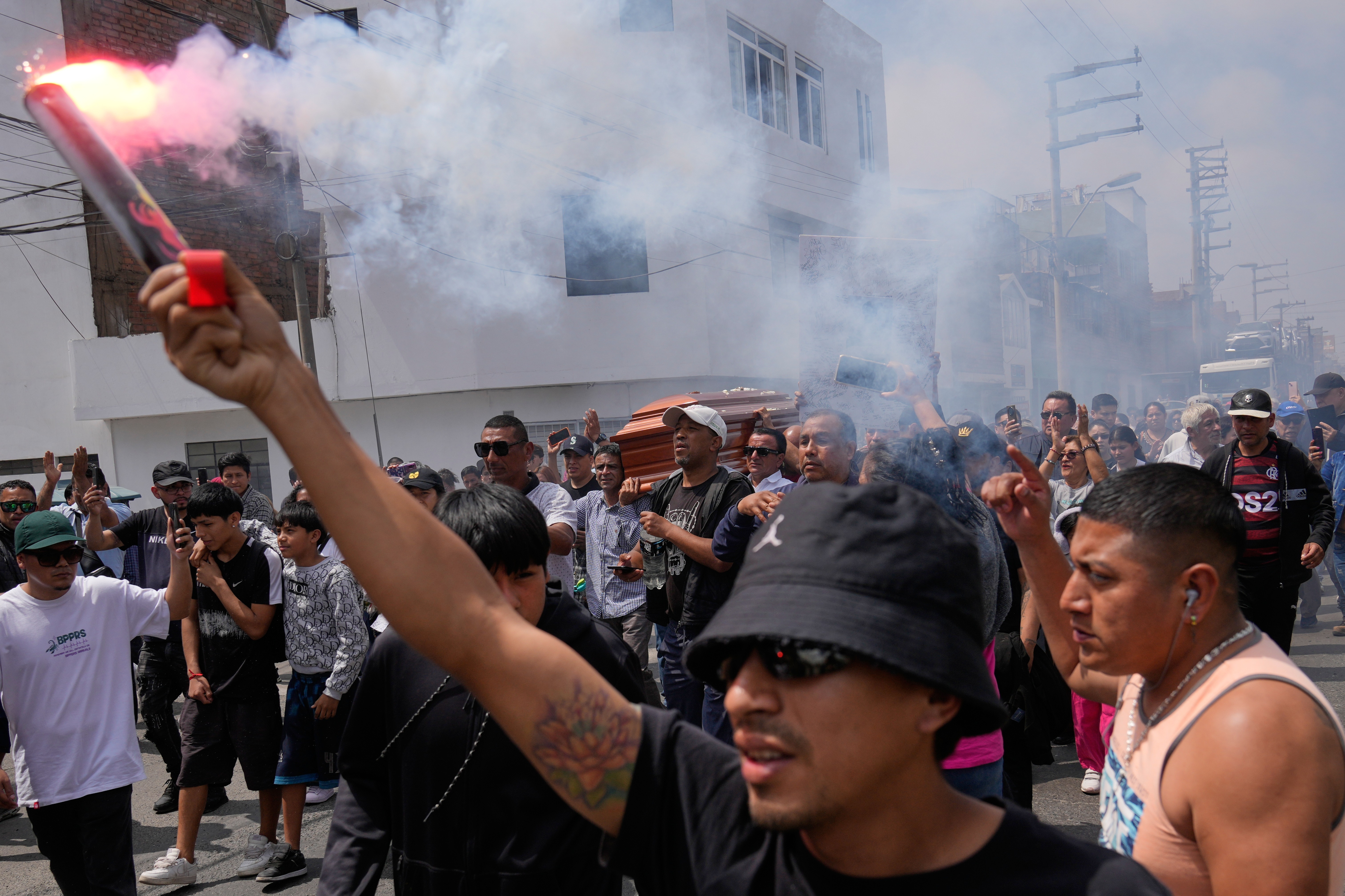 Relatives and friends carry the coffin of a protester who died during an overnight protest against the newly installed President Jose Jeri in Lima, Peru