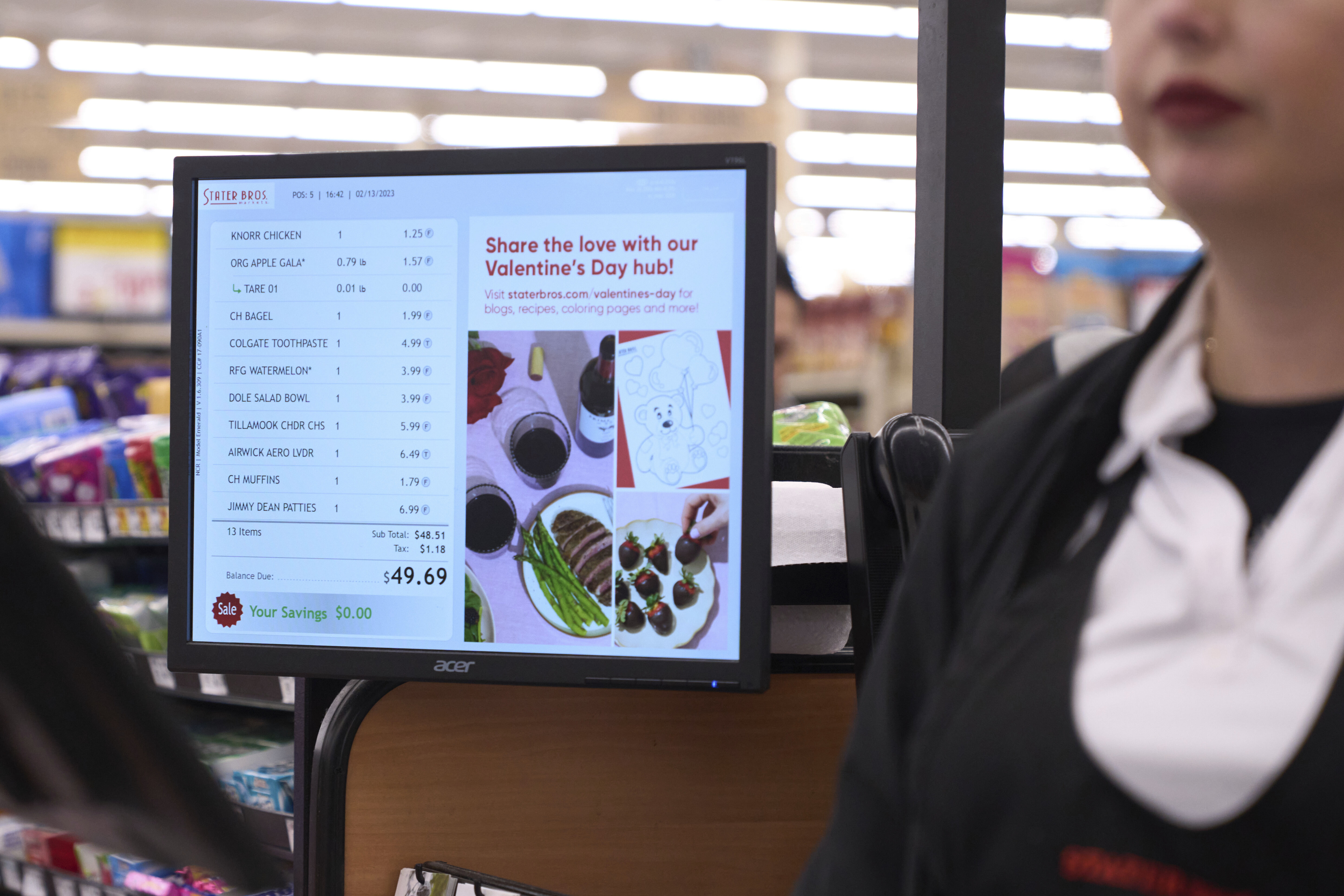 Jaqueline Benitez, who depends on California's SNAP benefits to help pay for food, pays for groceries at a supermarket in Bellflower, Calif., on Monday, Feb. 13, 2023. Officials in 32 states and other jurisdictions have been using texts, voicemails, snail mail, flyers and social media posts – all in multiple languages – to let recipients know that their extra food stamps end after February's payments. (AP Photo/Allison Dinner)