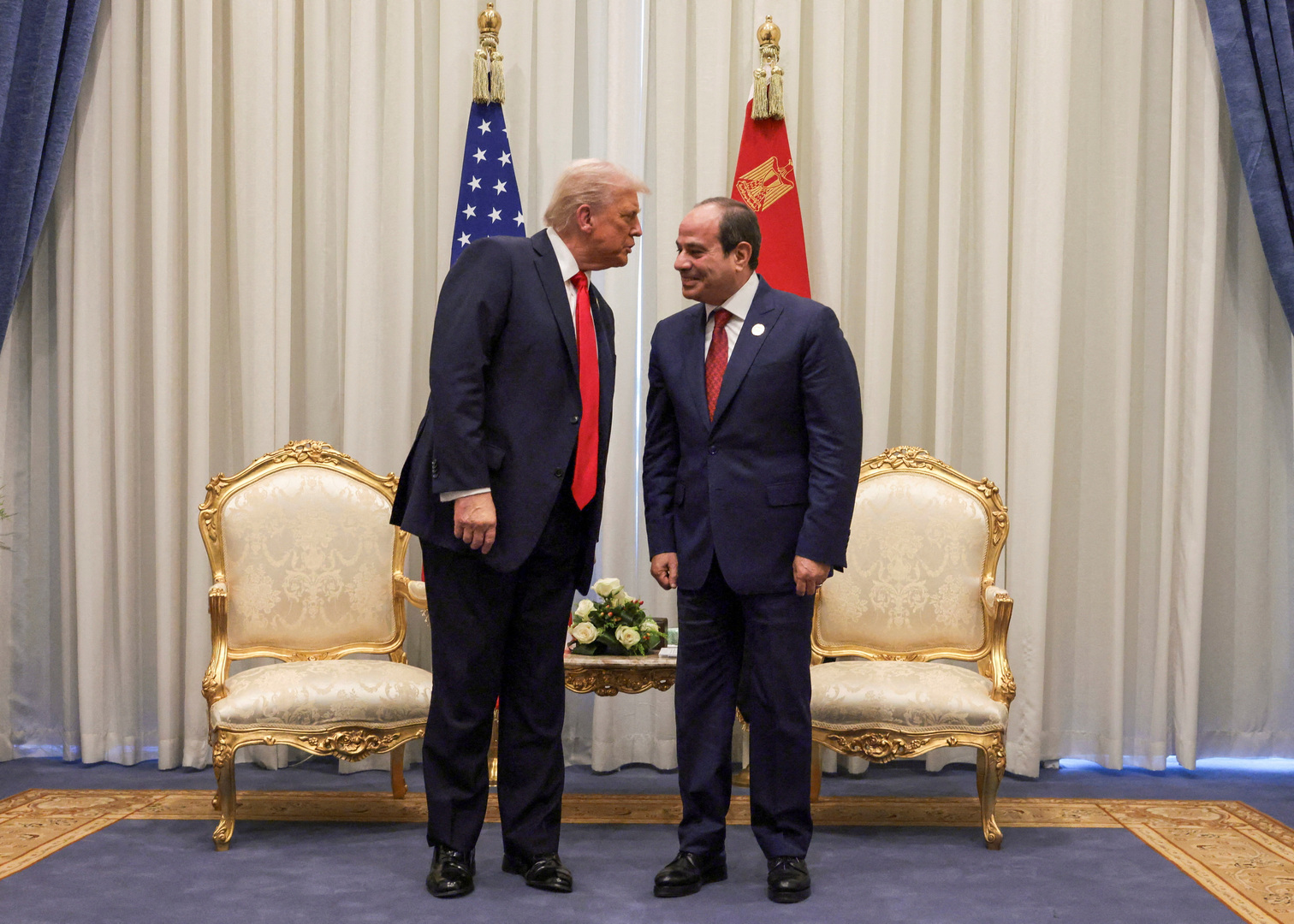 US President Donald Trump and Egyptian President Abdel Fattah el-Sisi meet ahead of a world leaders' summit on ending the Gaza war, amid a US-brokered prisoner-hostage swap and ceasefire deal between Israel and Hamas, in Sharm El-Sheikh, Egypt, Oct. 13, 2025. [Evelyn Hockstein/Reuters]