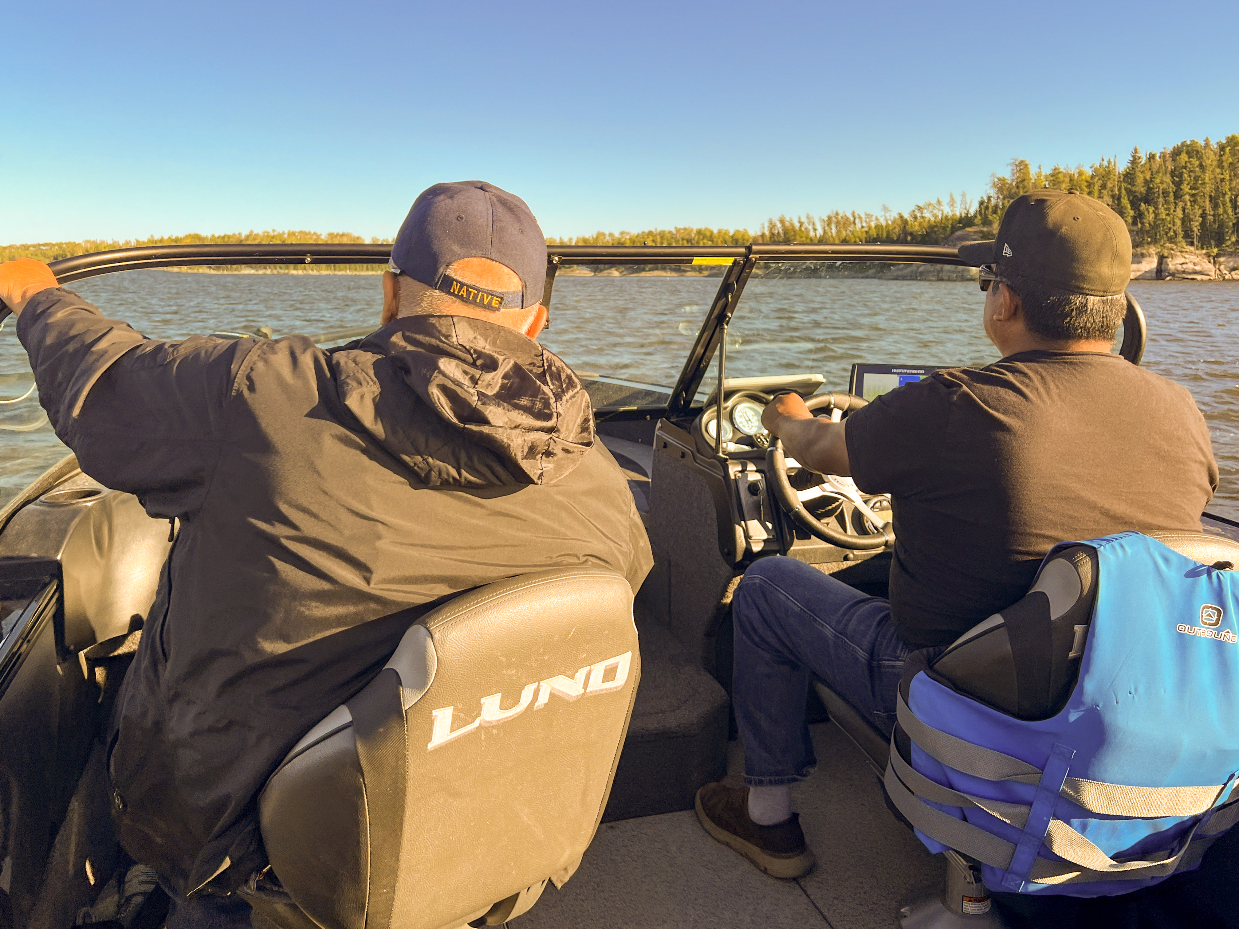 Joseph 'JB' Fobister (left) and his son, Mike Fobister, out on the water in Grassy Narrows First Nation