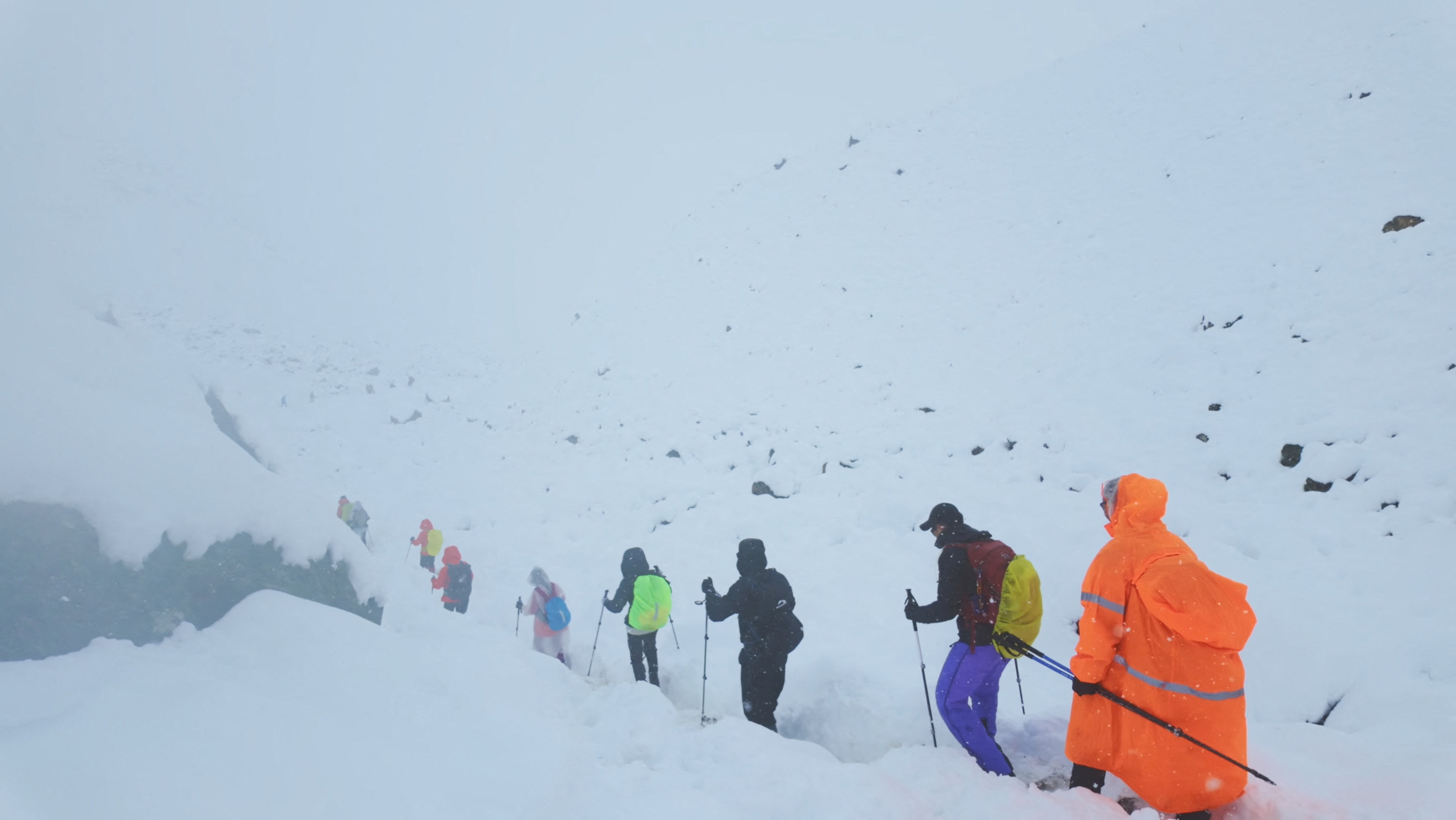 A screen capture from video shows trekkers leaving their campsite, as unusually heavy snow and rainfall pummeled the Himalayas, in the Tibet Region, China, October 5, 2025. Geshuang Chen/Handout via REUTERS. THIS IMAGE HAS BEEN SUPPLIED BY A THIRD PARTY NO RESALES. NO ARCHIVES. MANDATORY CREDIT
