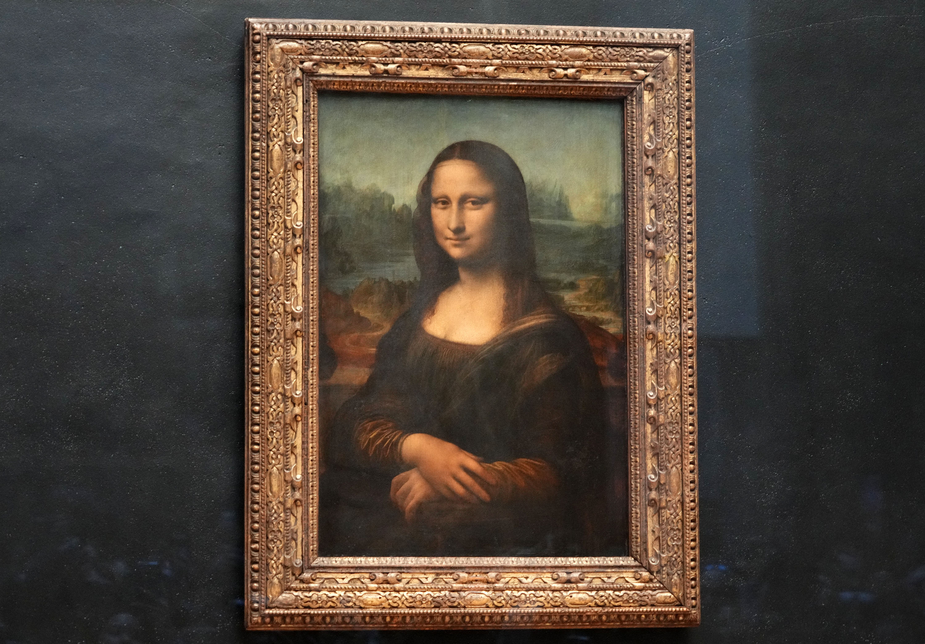 Jul 17, 2024; Paris, FRANCE; The Mona Lisa painting by Italian artist Leonardo da Vinci at the Louvre Museum as final preparations are underway for the Paris 2024 Olympic Summer Games. Mandatory Credit: Rob Schumacher-USA TODAY Sports
