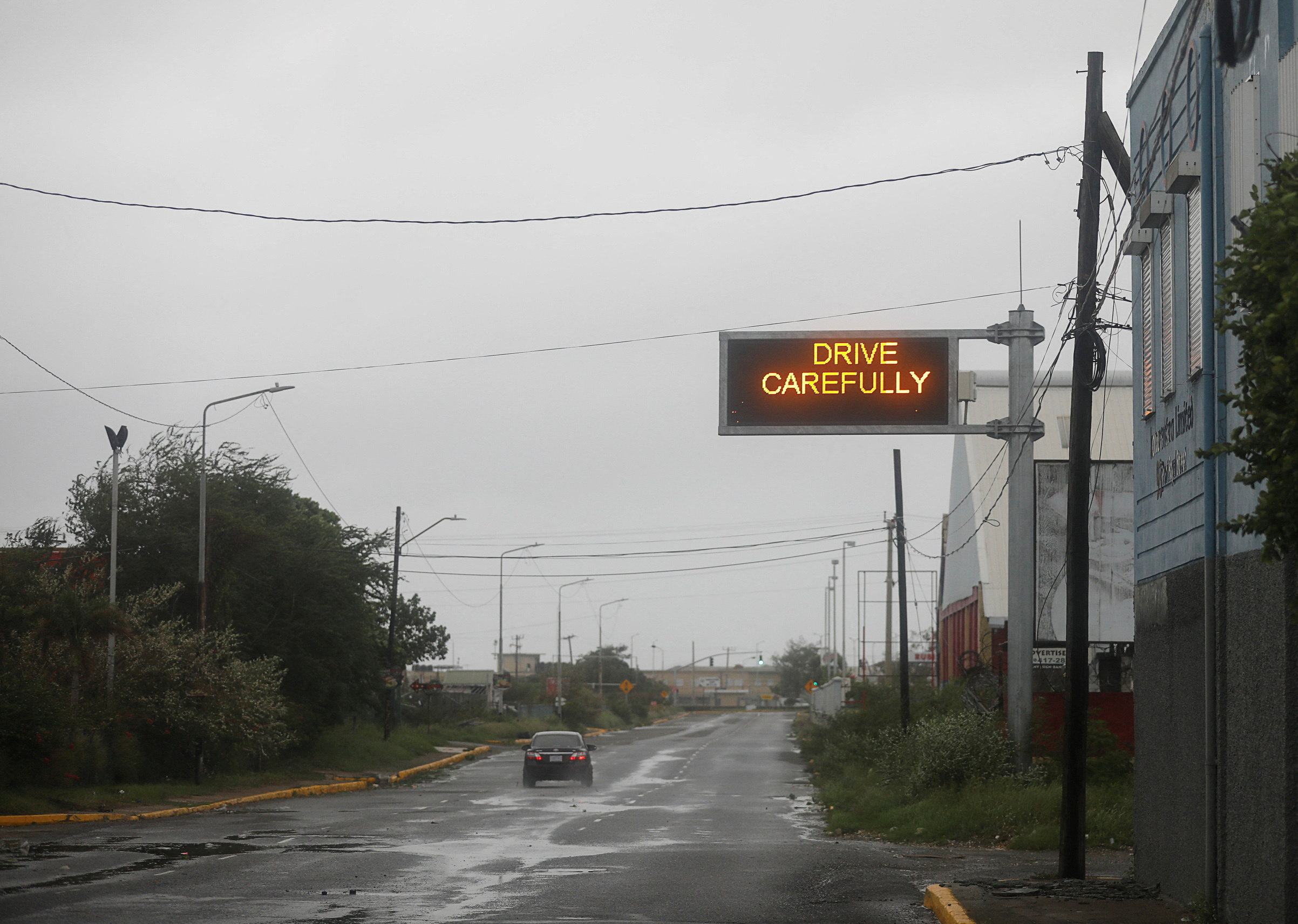 A car drives along a road, as Hurricane Melissa approaches, in Kingston, Jamaica, October 28, 2025. REUTERS/Octavio Jones