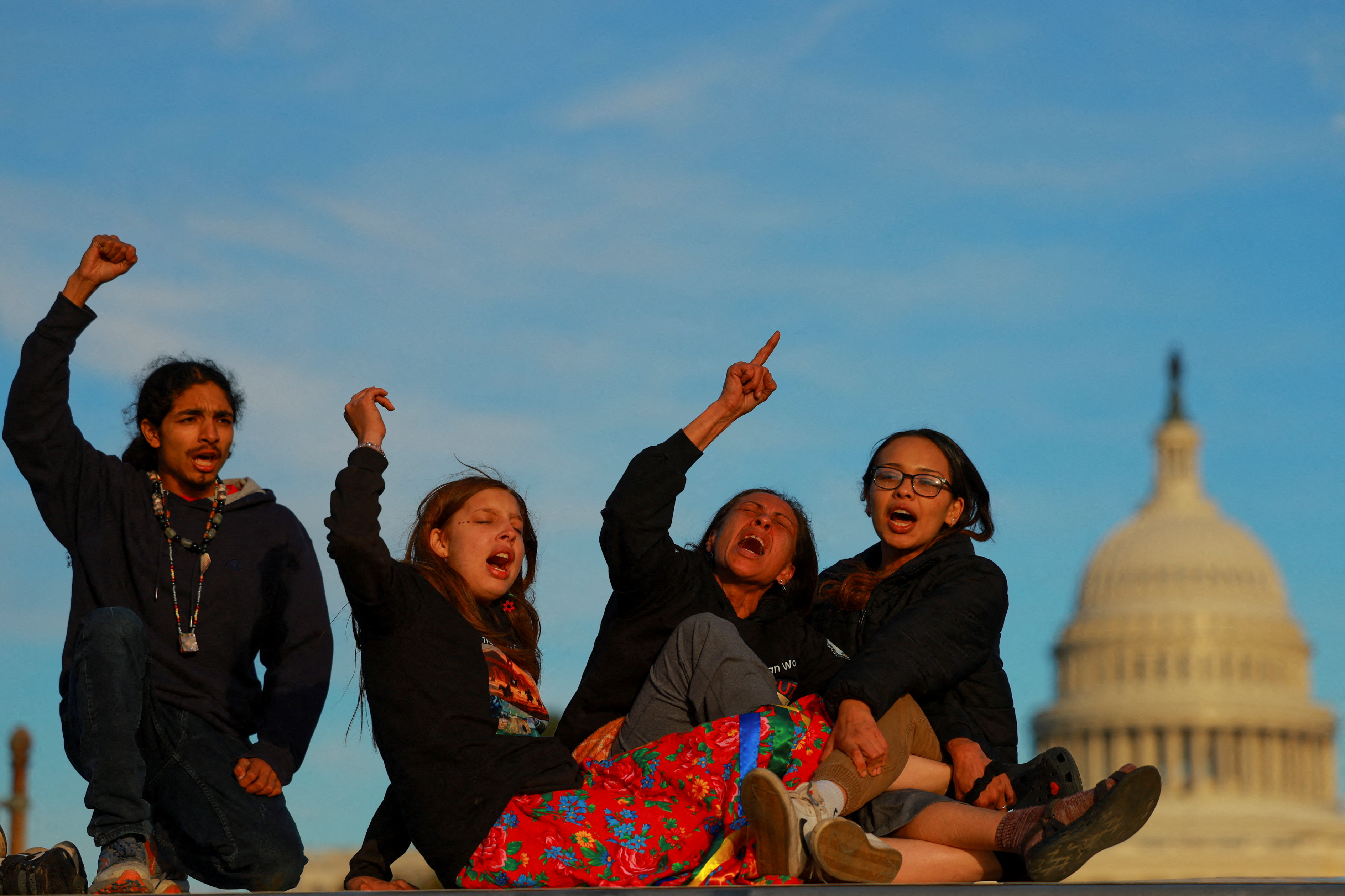 People protest in support of Native American tribes in front of the United States Capitol, in Washington, DC, October 15, 2024 [Jose Luis Gonzalez/Reuters]