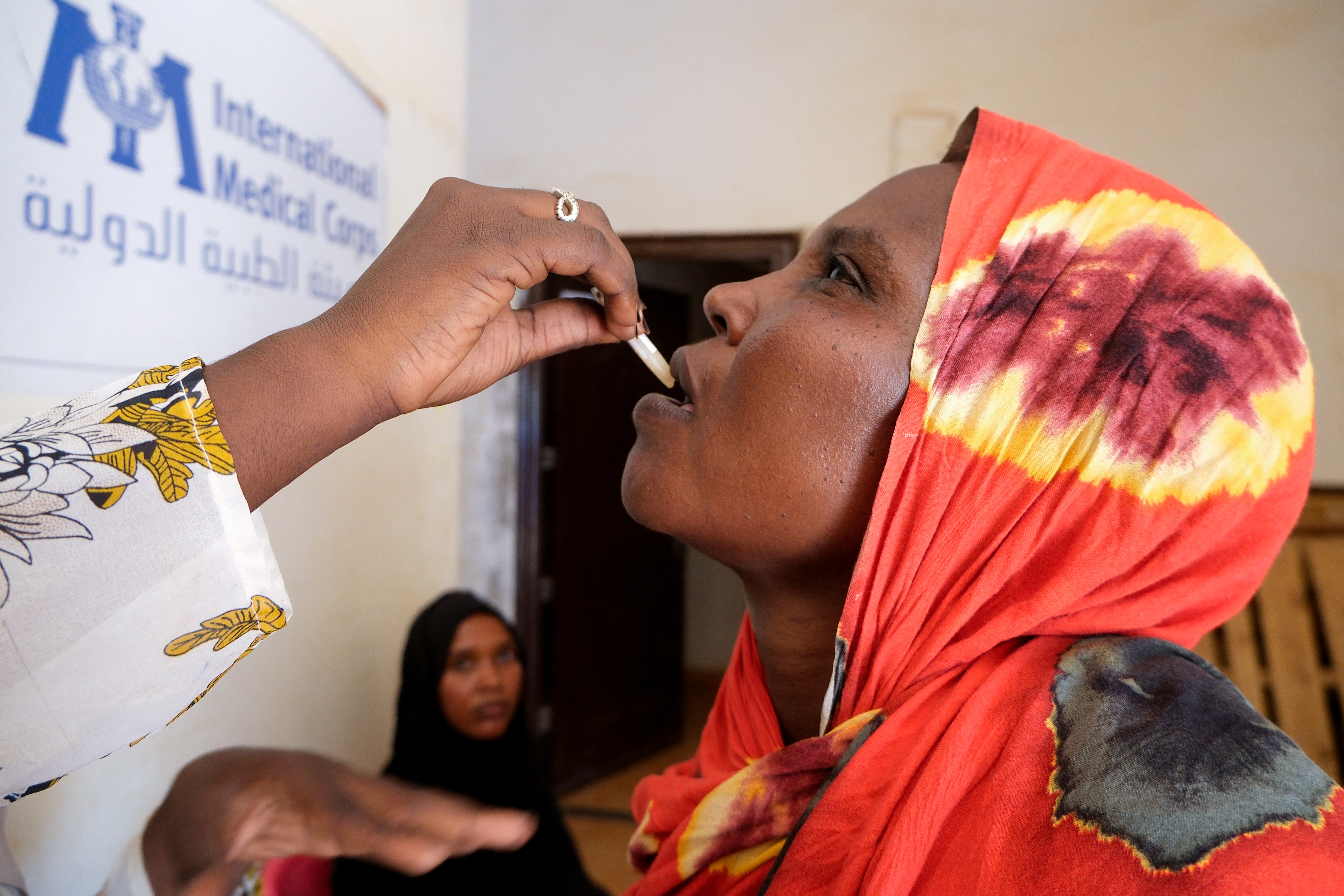 A Sudanese woman receives a dose of a cholera vaccine in Khartoum in September [El Tayeb Siddig/Reuters]