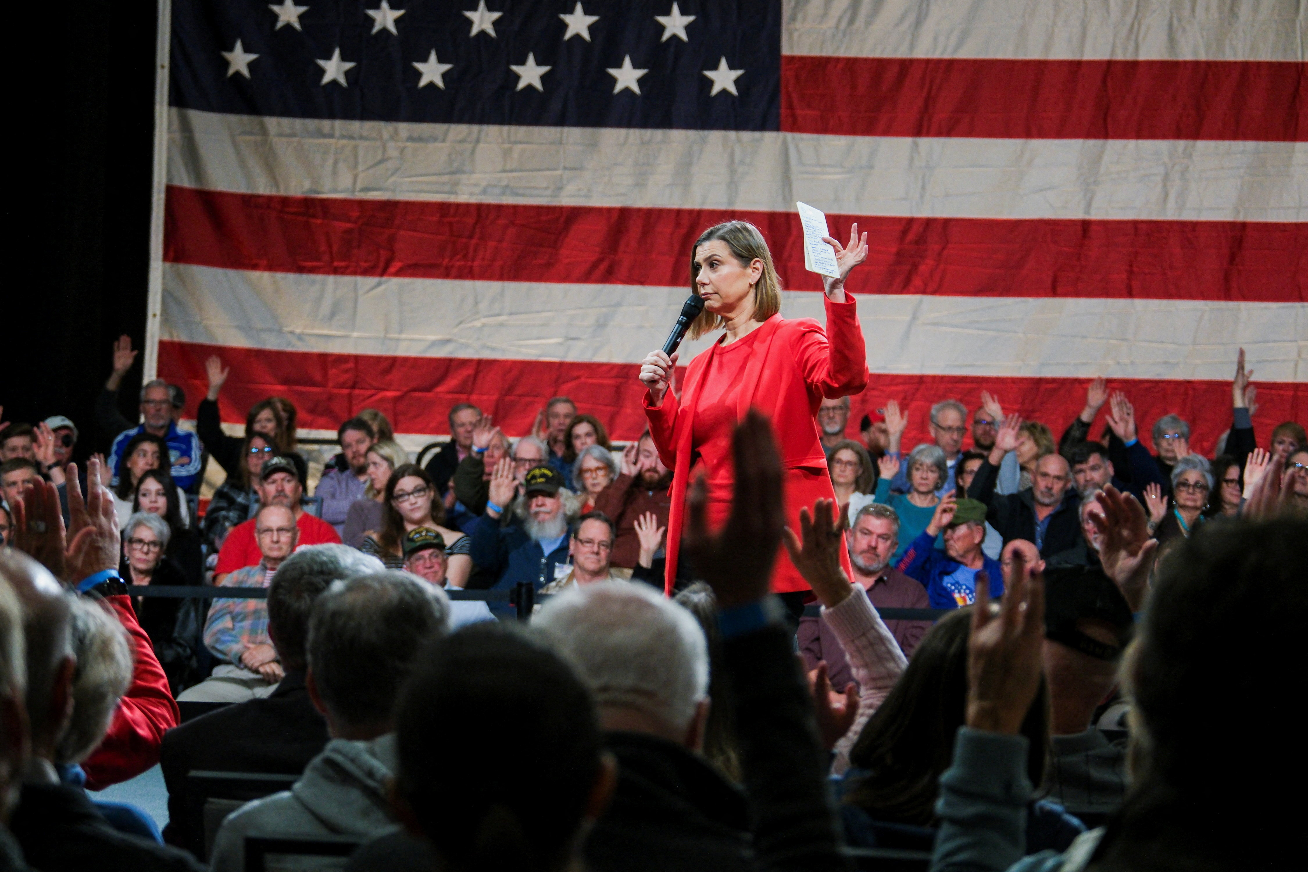 U.S. Senator Elissa Slotkin (D-MI) asks attendees if their living expenses have recently increased, during a VoteVets town hall in Overland Park, Kansas, U.S., November 12, 2025.