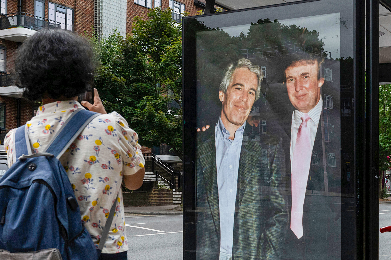 A poster of Trump and Epstein pasted onto a busstop