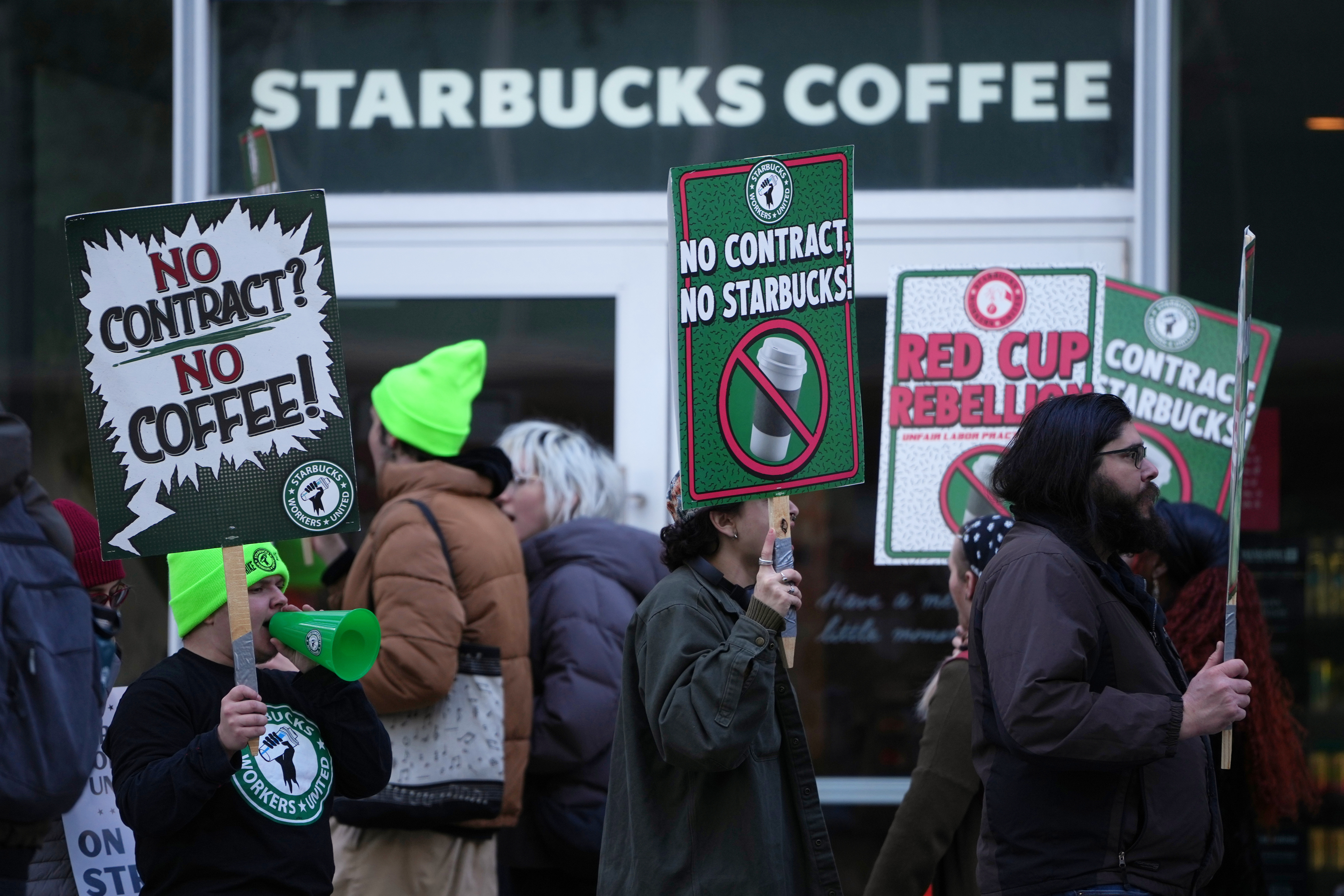 Protesters picket outside a Starbucks in Philadelphia, US