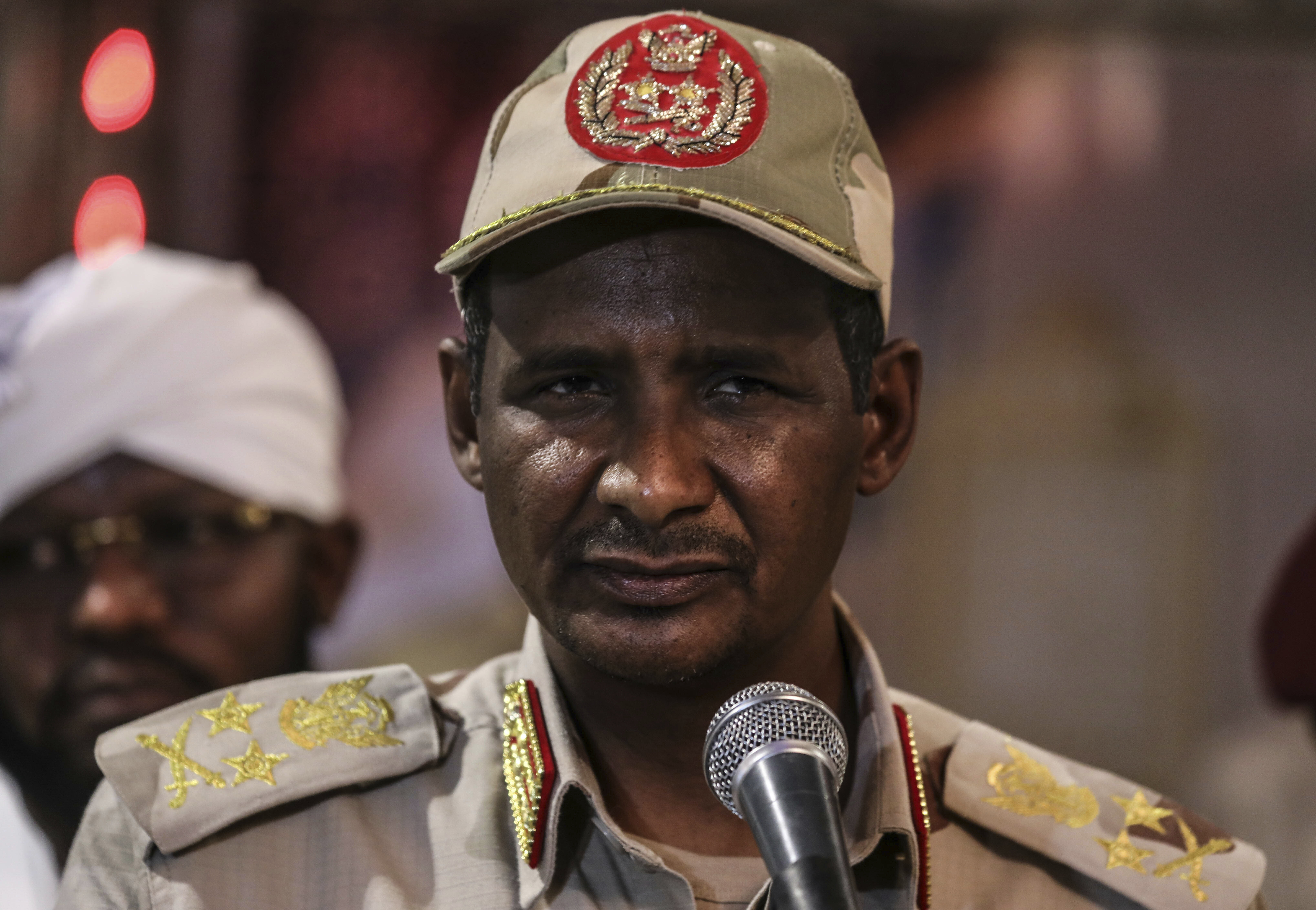 In this Saturday, May 18, 2019 photo, Gen. Mohammed Hamdan Dagalo, better known as Hemedti, the deputy head of the military council that assumed power in Sudan after the overthrow of President Omar al-Bashir, speaks at a press conference after a Ramadan event, in Khartoum, Sudan. Dagalo says he refused orders from al-Bashir to fire on the protesters, and he praised them as recently as last weekend. Many likely see him as an ally against the Islamic movement that orchestrated al-Bashir’s 1989 coup and underpinned his regime. (AP Photo)