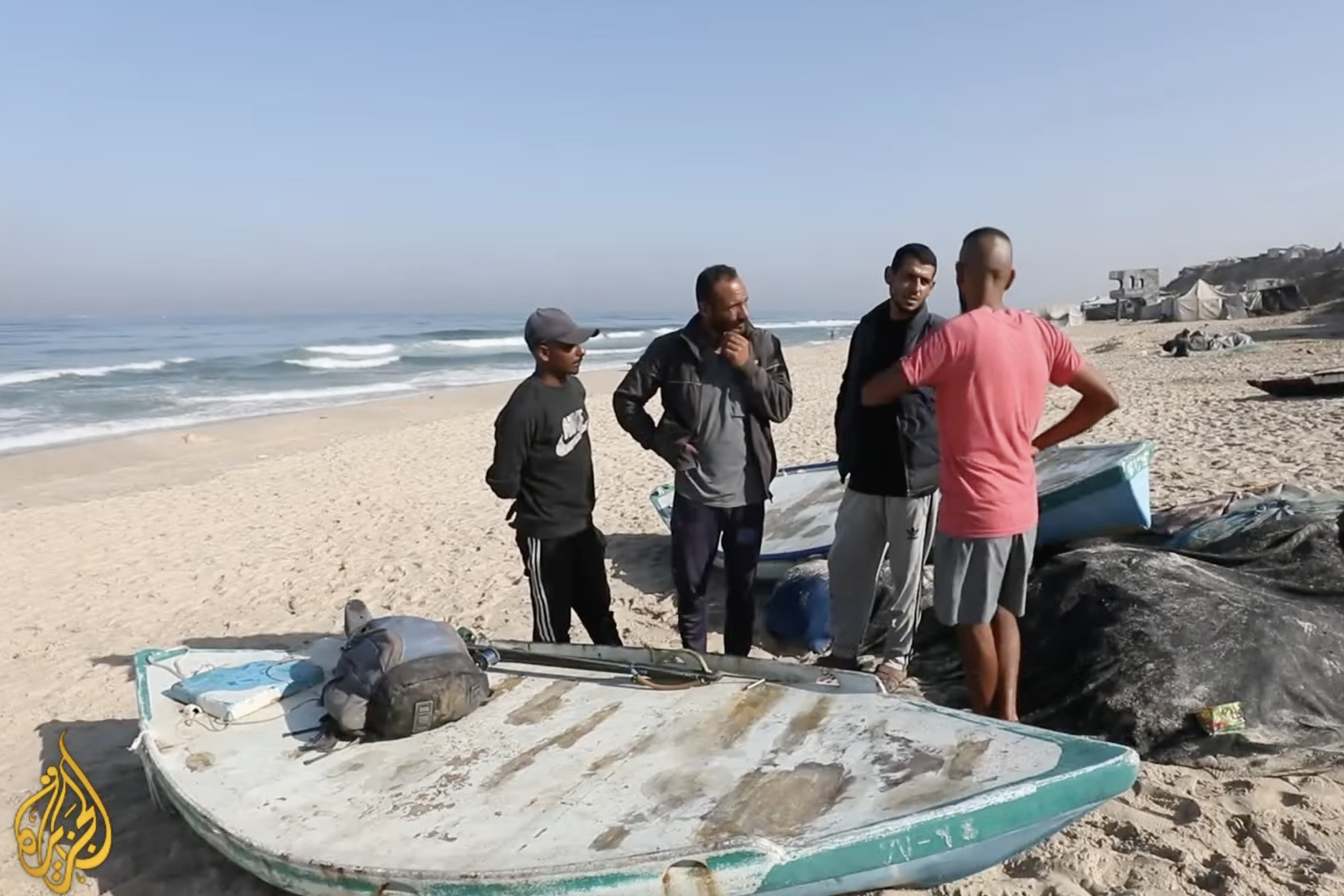 Gaza's local fishermen preparing their boats before going out at sea [Al Jazeera]