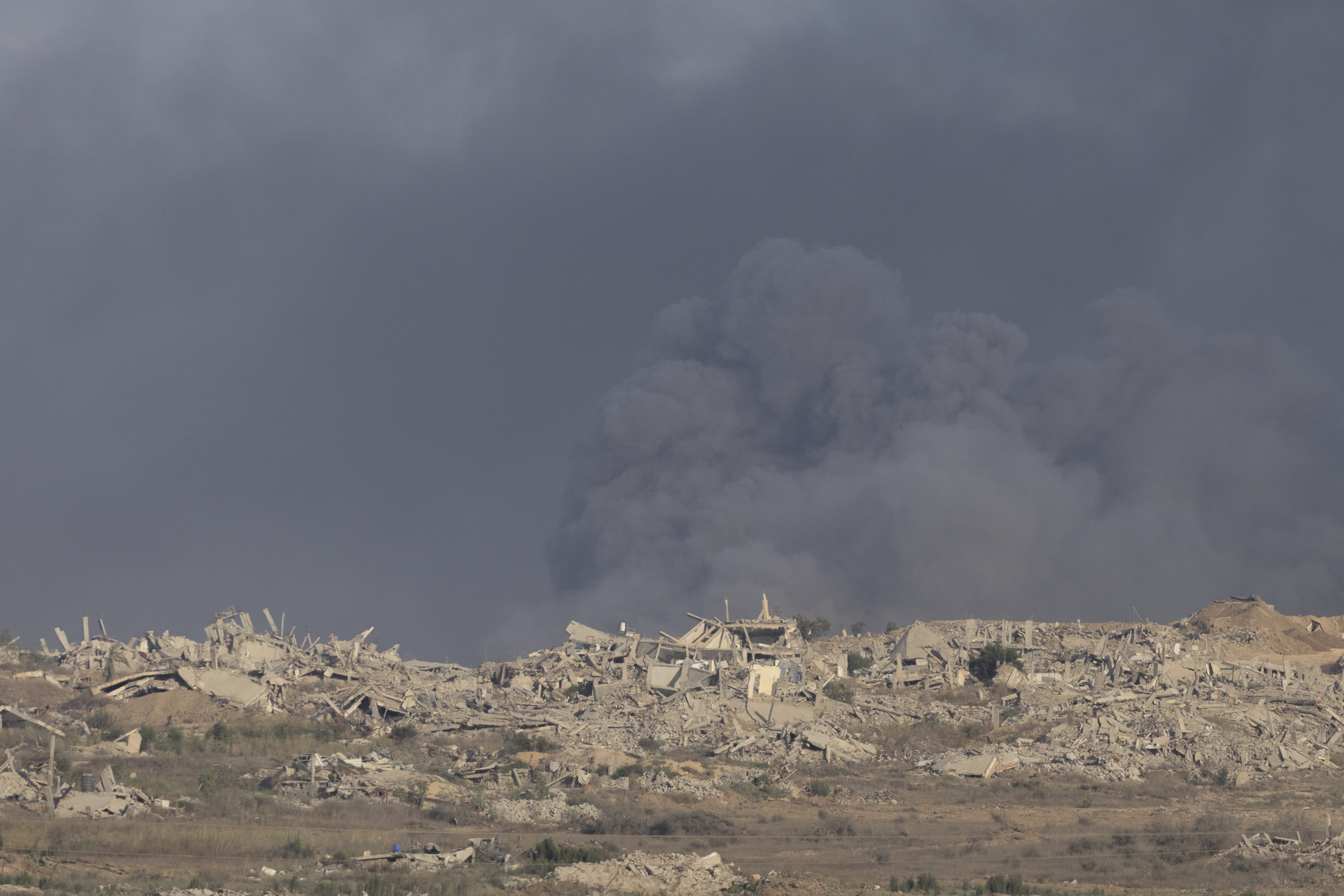 SOUTHERN ISRAEL, ISRAEL - AUGUST 31: Smoke rises after an explosion in the Gaza Strip as seen from a position on the Israeli side of the border on August 31, 2025 in Southern Israel, Israel. An Israel Defence Forces (IDF) spokesman has called the evacuation of one million people in Gaza City "inevitable," following approval earlier this month of Prime Minister Benjamin Netanyahu's plans to expand IDF occupation of the Gaza Strip, including taking "complete control" of Gaza City. As the IDF intensifies its campaign, the new offensive has been met with growing condemnation both at home and abroad. Mass demonstrations in Israel in recent days have called for the return of the remaining hostages and an end to the war, while international human rights groups have said the campaign constitutes a clear breach of international law. (Photo by Amir Levy/Getty Images)